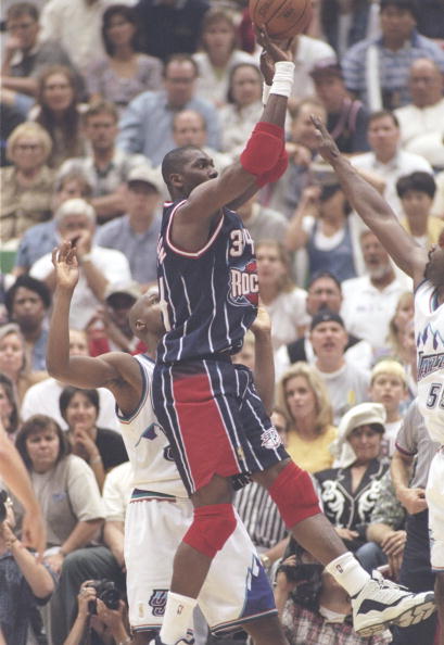 21 May 1997:  Center Hakeem Olajuwon of the Houston Rockets shoots the ball over forward Antoine Carr of the Utah Jazz during  playoff game at the Delta Center in Salt Lake City, Utah.  The Jazz won the game 104-92. Mandatory Credit: Brian Bahr  /Allsport