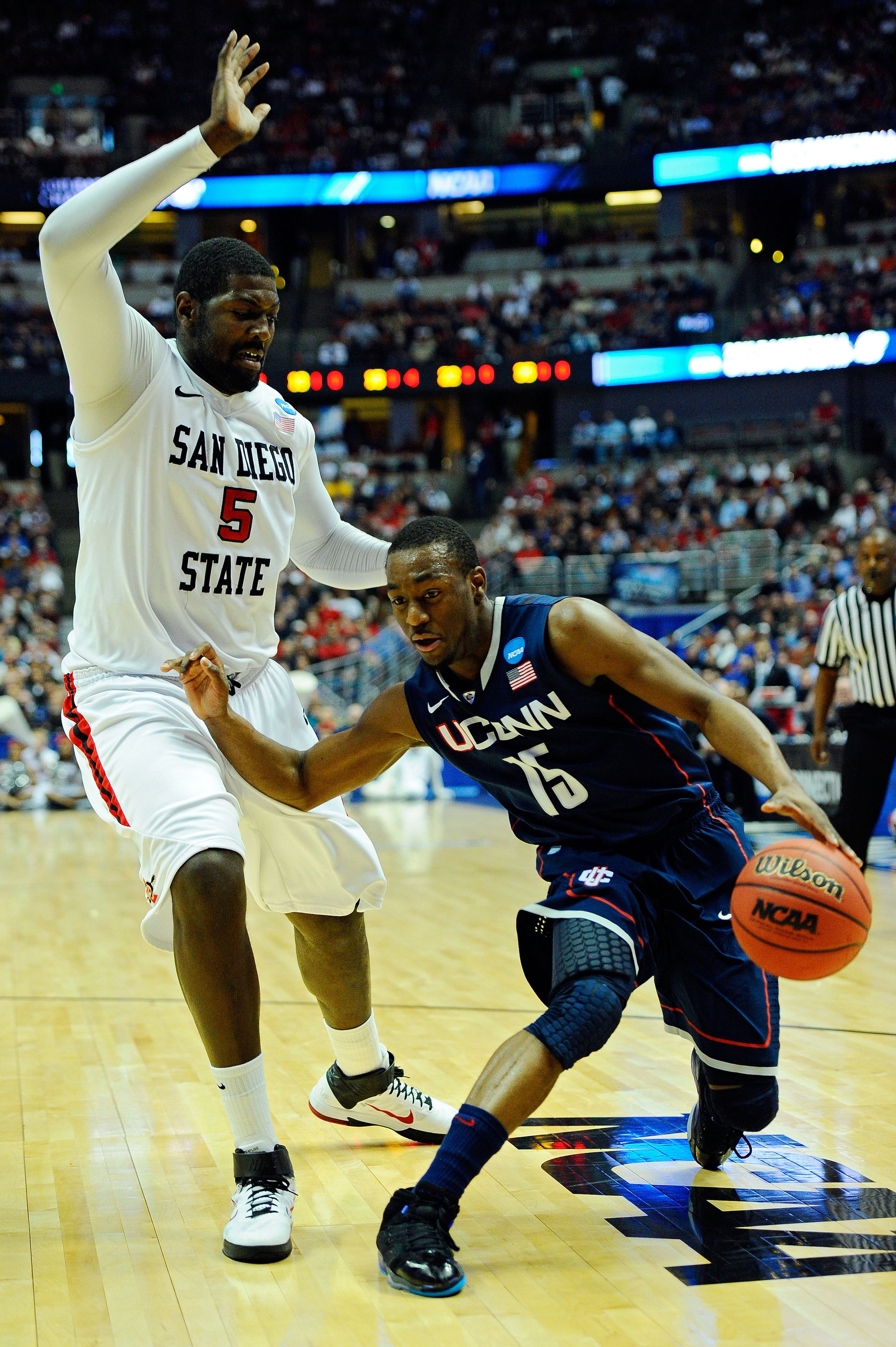ANAHEIM, CA - MARCH 24: Kemba Walker #15 of the Connecticut Huskies handles the ball against Brian Carlwell #5 of the San Diego State Aztecs during the west regional semifinal of the 2011 NCAA men's basketball tournament at the Honda Center on March 24, ANAHEIM, CA - MARCH 24: Kemba Walker #15 of the Connecticut Huskies handles the ball against Brian Carlwell #5 of the San Diego State Aztecs during the west regional semifinal of the 2011 NCAA men's basketball tournament at the Honda Center on March 24,