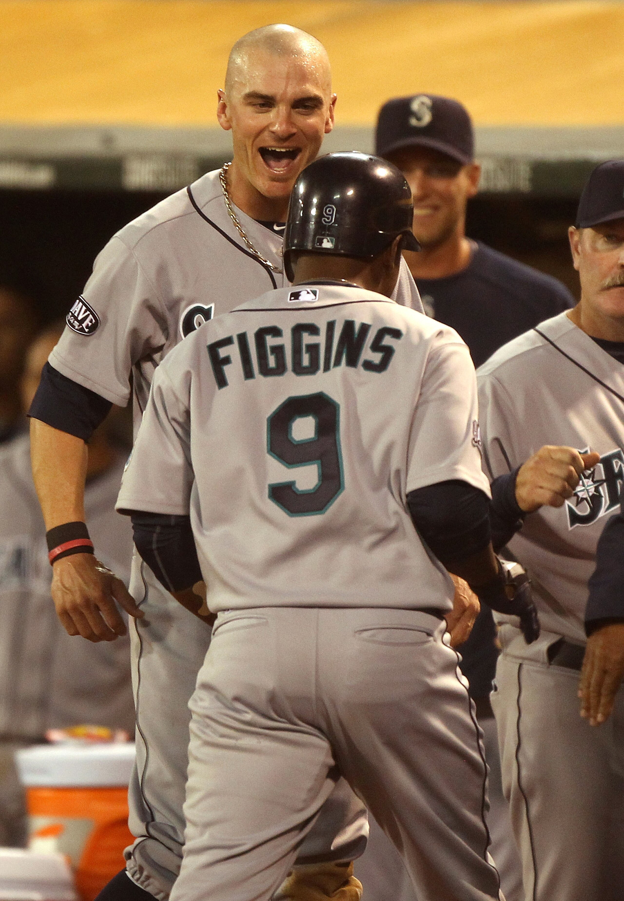 OAKLAND, CA - APRIL 01: Chone Figgins #9 of the Seattle Mariners celebrates with teammate Brendan Ryan #26 after hitting a solo home run against the Oakland Athletics during an opening day game of Major League Baseball at the Oakland-Alameda County Colis OAKLAND, CA - APRIL 01: Chone Figgins #9 of the Seattle Mariners celebrates with teammate Brendan Ryan #26 after hitting a solo home run against the Oakland Athletics during an opening day game of Major League Baseball at the Oakland-Alameda County Colis
