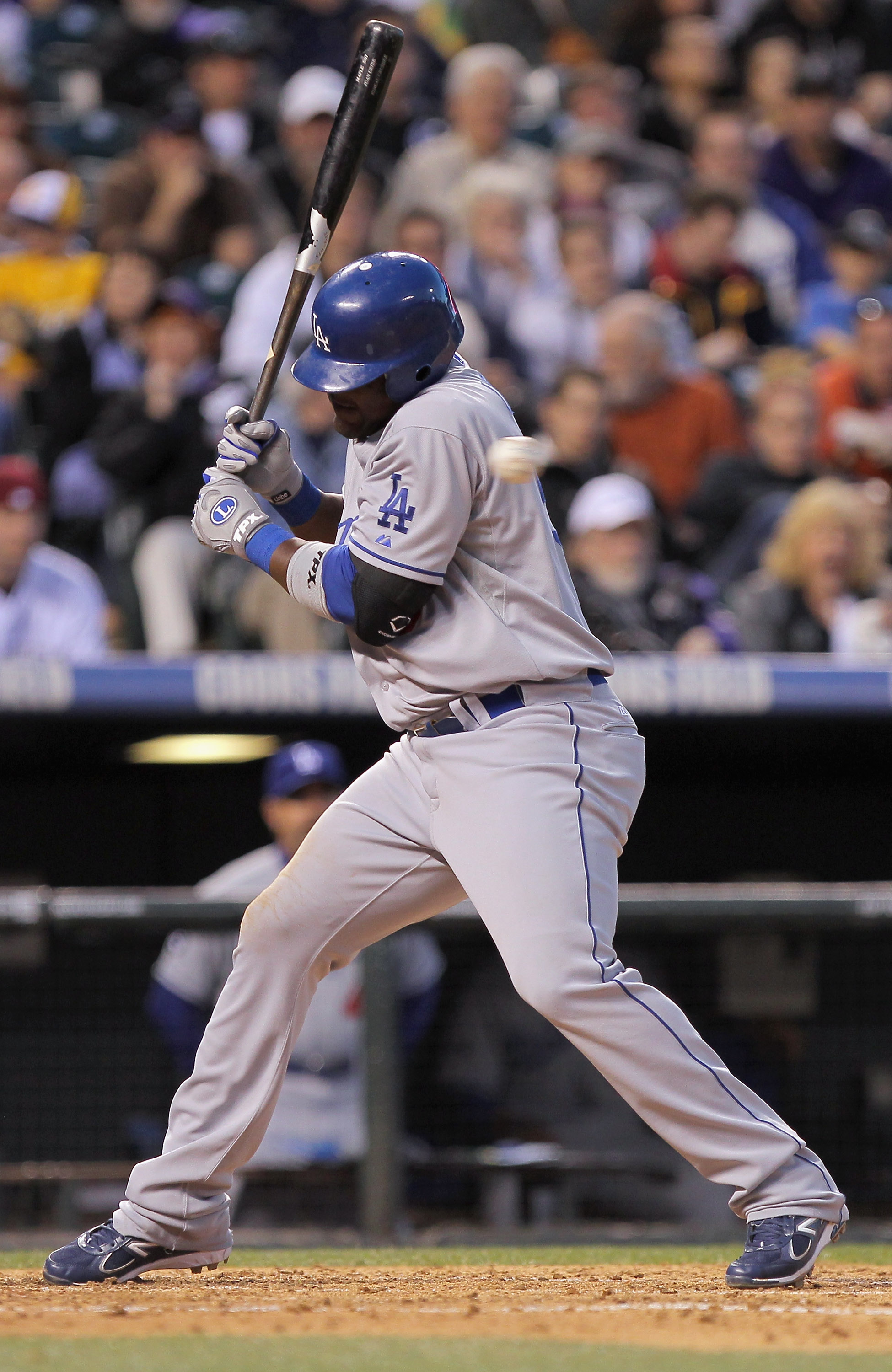 DENVER, CO - APRIL 05:  Juan Uribe #5 of the Los Angeles Dodgers dodges an inside pitch from Jhoulys Chacin #45 of the Colorado Rockies at Coors Field on April 5, 2011 in Denver, Colorado.  (Photo by Doug Pensinger/Getty Images)