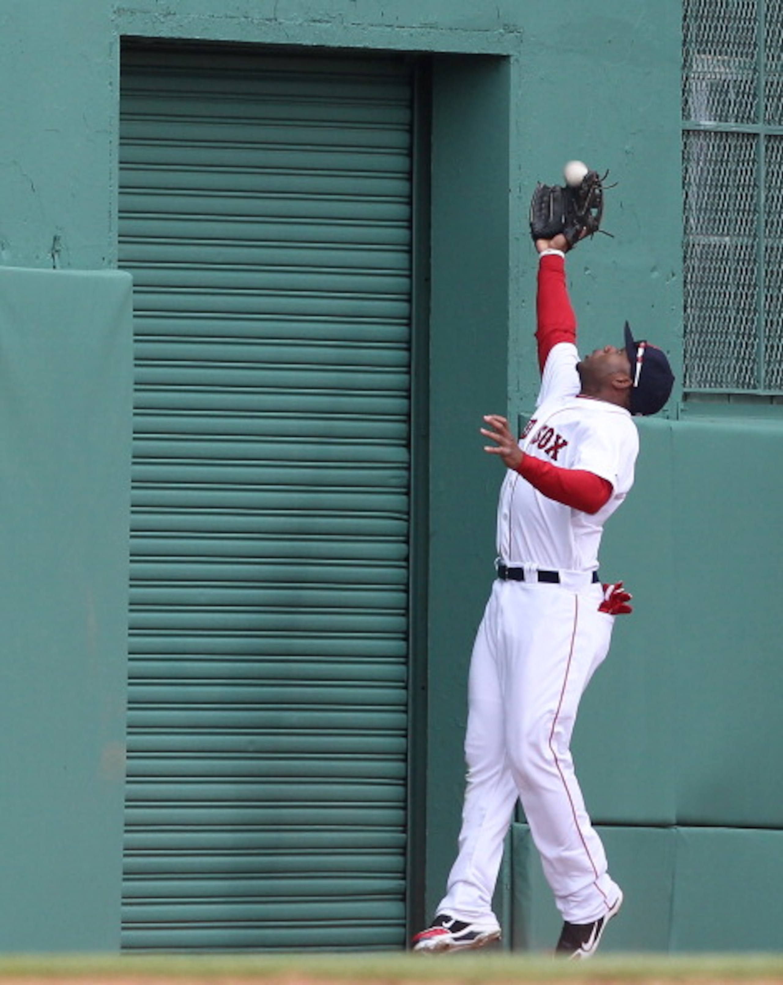 BOSTON, MA - APRIL 8: Carl Crawford #13 of the Boston Red Sox snags a fly ball against the New York Yankees during Opening Day at Fenway Park on April 8, 2011 in Boston, Massachusetts. (Photo by Jim Rogash/Getty Images) BOSTON, MA - APRIL 8: Carl Crawford #13 of the Boston Red Sox snags a fly ball against the New York Yankees during Opening Day at Fenway Park on April 8, 2011 in Boston, Massachusetts. (Photo by Jim Rogash/Getty Images)
