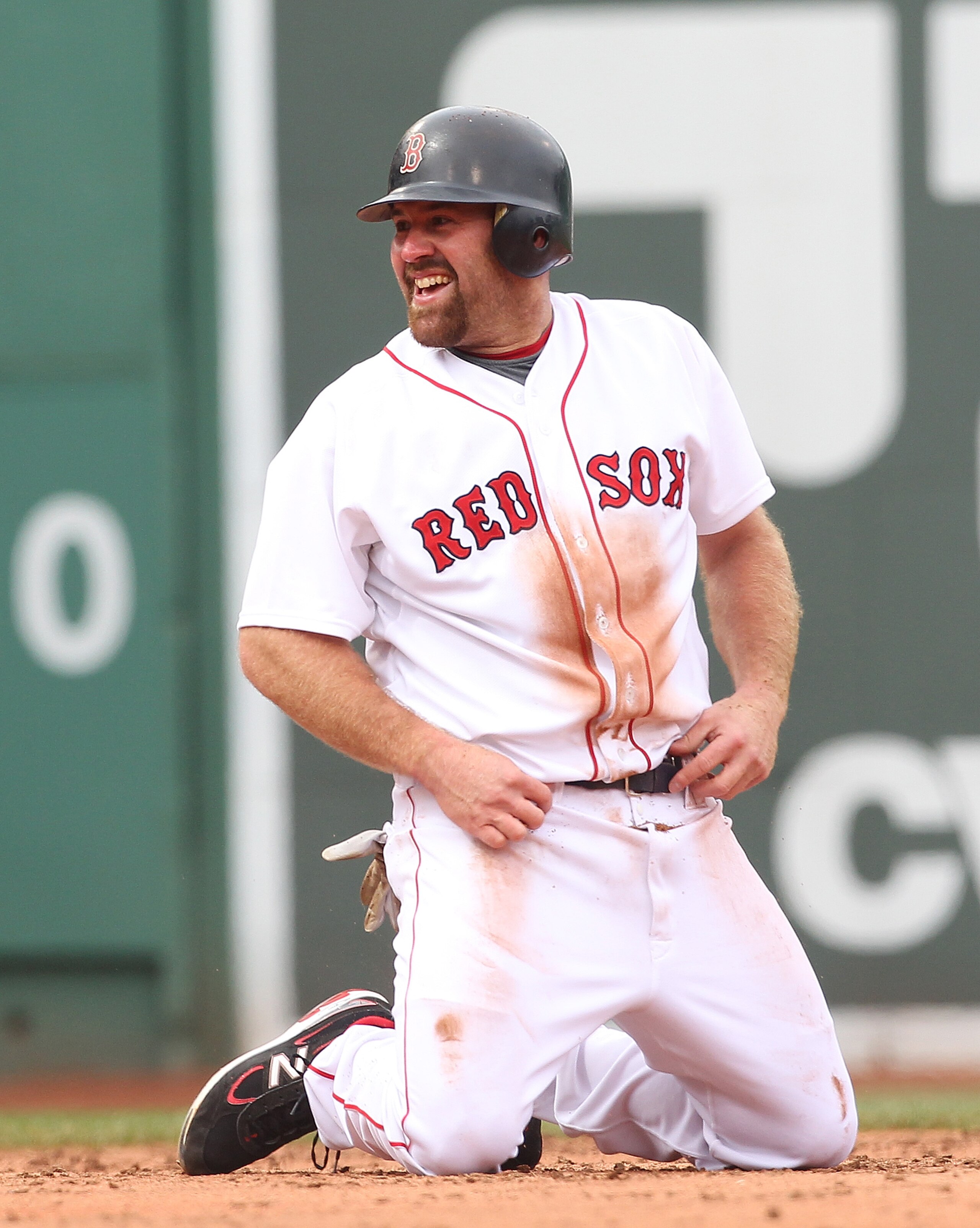 BOSTON, MA - APRIL 8: Kevin Youkilis #20 of the Boston Red Sox smiles after being tagged out in a run down against the New York Yankees on Opening Day at Fenway Park on April 8, 2011 in Boston, Massachusetts. (Photo by Jim Rogash/Getty Images) BOSTON, MA - APRIL 8: Kevin Youkilis #20 of the Boston Red Sox smiles after being tagged out in a run down against the New York Yankees on Opening Day at Fenway Park on April 8, 2011 in Boston, Massachusetts. (Photo by Jim Rogash/Getty Images)