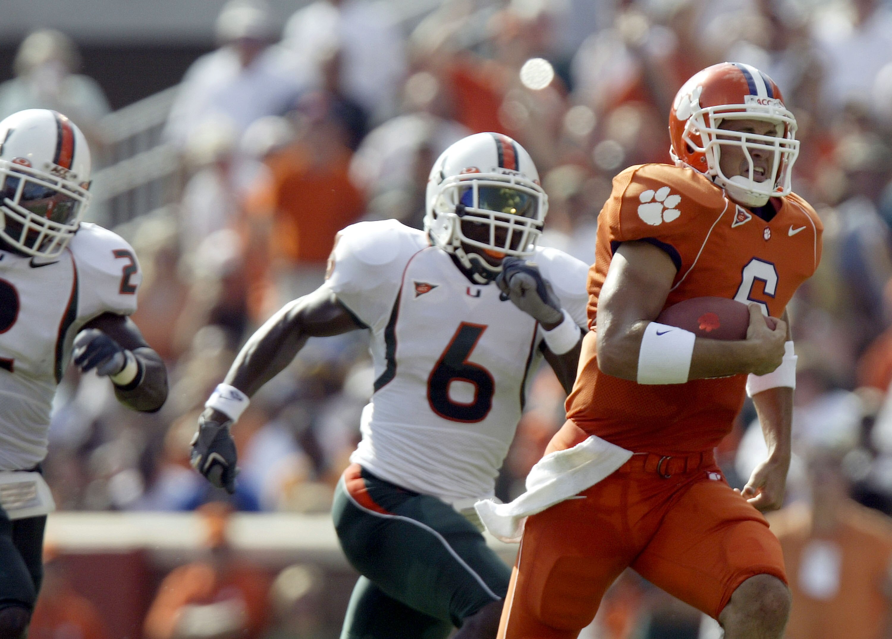 CLEMSON, SC - SEPTEMBER 17:  Charlie Whitehurst #6 of the Clemson Tigers runs by Randy Phillips #6 of the Miami Hurricanes at Memorial Stadium on September 17, 2005 in Clemson, South Carolina.  (Photo by Craig Jones/Getty Images)