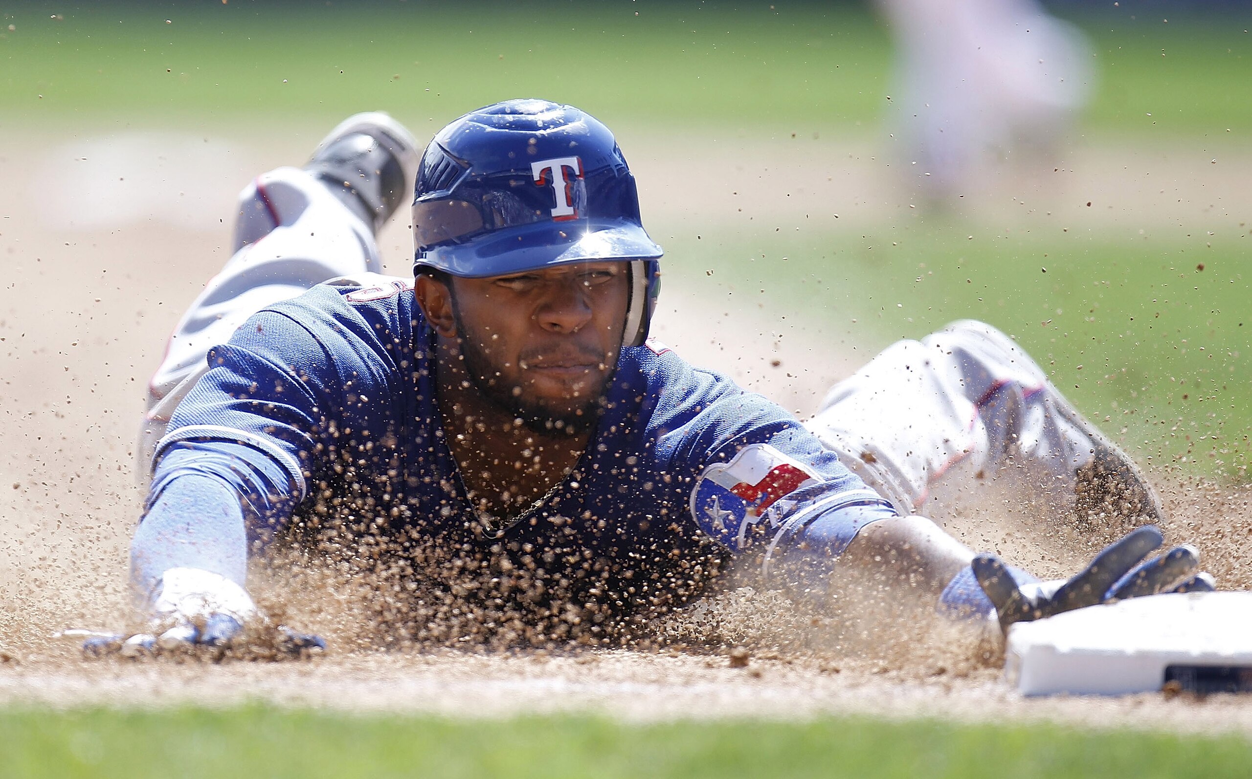 DETROIT, MI - APRIL 12: Elvis Andrus #1 of the Texas Rangers steals third base in the sixth inning while playing the Detroit Tigers at Comerica Park on April 12, 2011 in Detroit, Michigan. Detroit won the game 5-4. (Photo by Gregory Shamus/Getty Images) DETROIT, MI - APRIL 12: Elvis Andrus #1 of the Texas Rangers steals third base in the sixth inning while playing the Detroit Tigers at Comerica Park on April 12, 2011 in Detroit, Michigan. Detroit won the game 5-4. (Photo by Gregory Shamus/Getty Images)