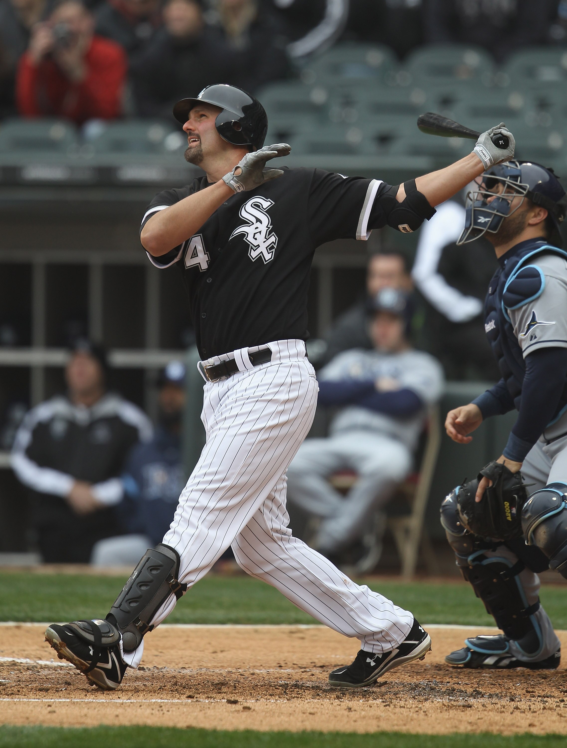 CHICAGO, IL - APRIL 07: Paul Konerko #14 of the Chicago White Sox hits the ball against the Tampa Bay Rays during the home opener at U.S. Cellular Field on April 7, 2011 in Chicago, Illinois. The White Sox defeated the Rays 5-1. (Photo by Jonathan Daniel/