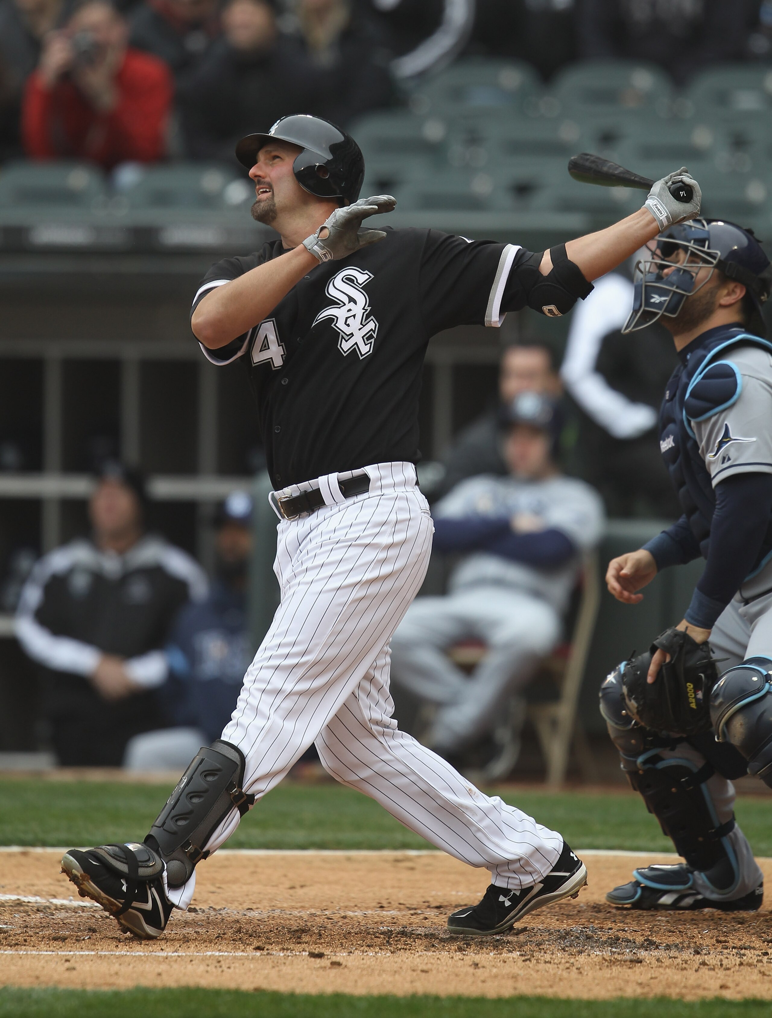 CHICAGO, IL - APRIL 07: Paul Konerko #14 of the Chicago White Sox hits the ball against the Tampa Bay Rays during the home opener at U.S. Cellular Field on April 7, 2011 in Chicago, Illinois. The White Sox defeated the Rays 5-1. (Photo by Jonathan Daniel/