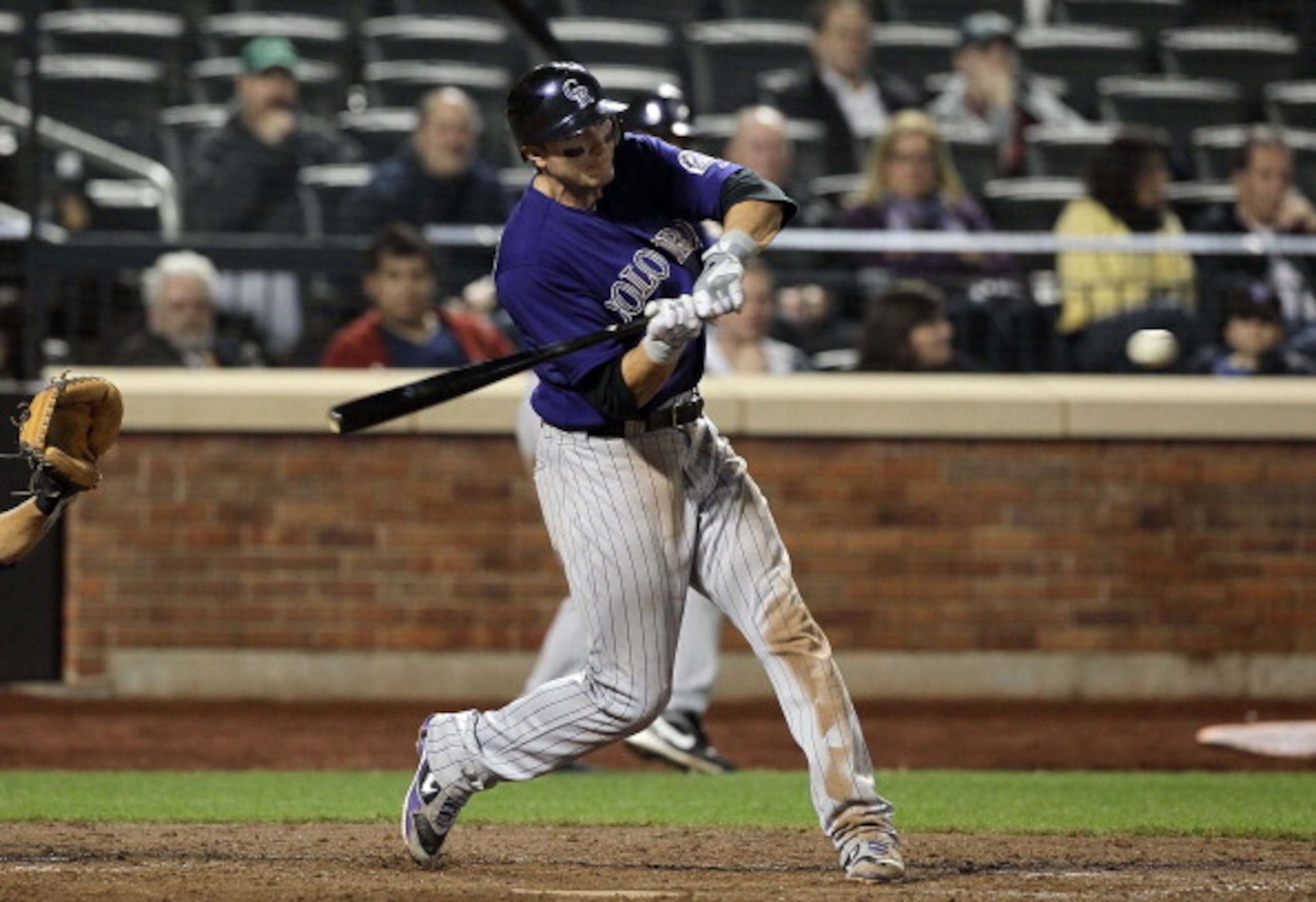 NEW YORK, NY - APRIL 11:  Troy Tulowitzki #2 of the Colorado Rockies connects on a seventh inning two-run home run against of the New York Mets on April 11, 2011 at Citi Field in the Flushing neighborhood of the Queens borough of New York City.  (Photo by