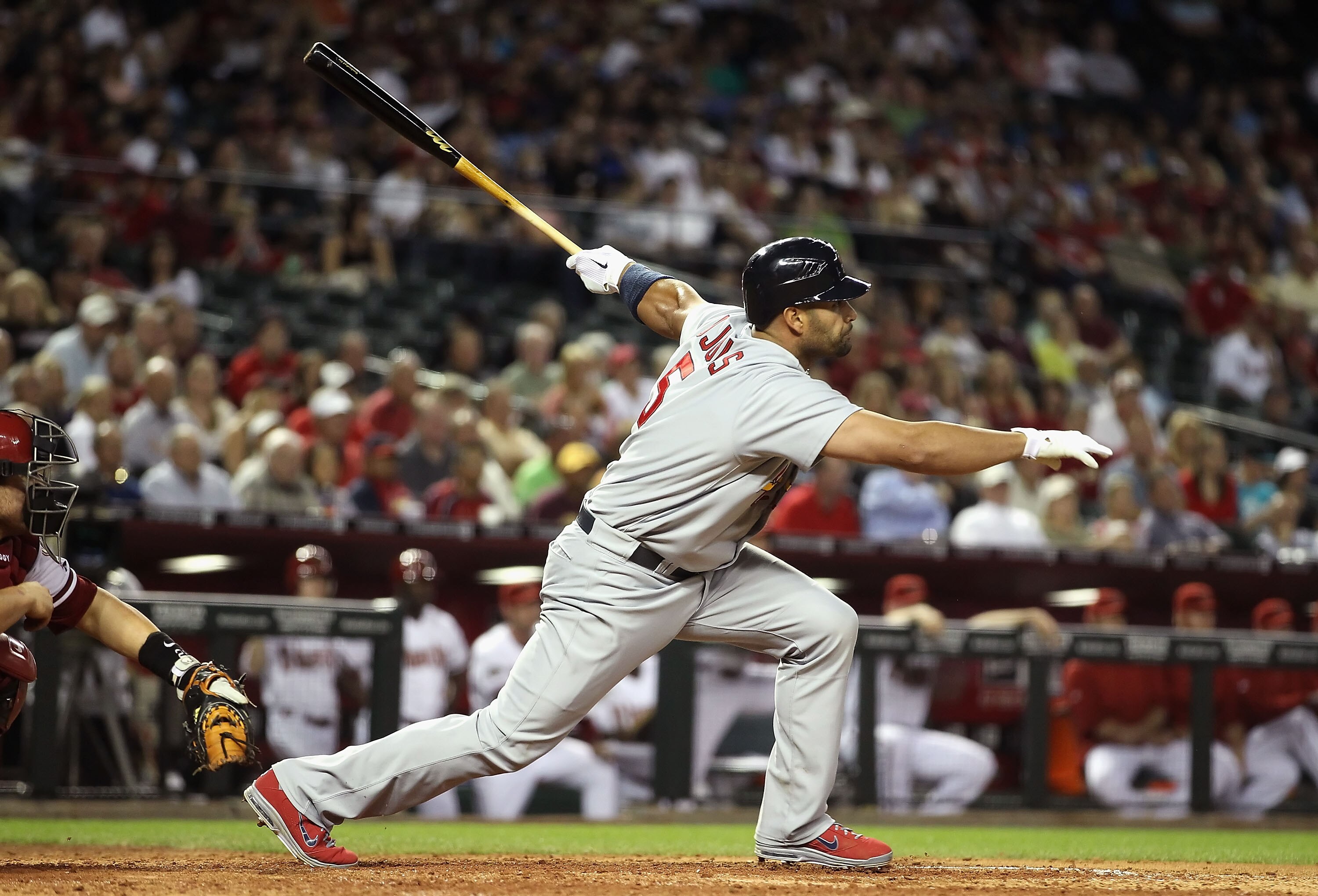 PHOENIX, AZ - APRIL 12:  Albert Pujols #5 of the St. Louis Cardinals hits a single against the Arizona Diamondbacks during the fifth inning of the Major League Baseball game at Chase Field on April 12, 2011 in Phoenix, Arizona.  (Photo by Christian Peters