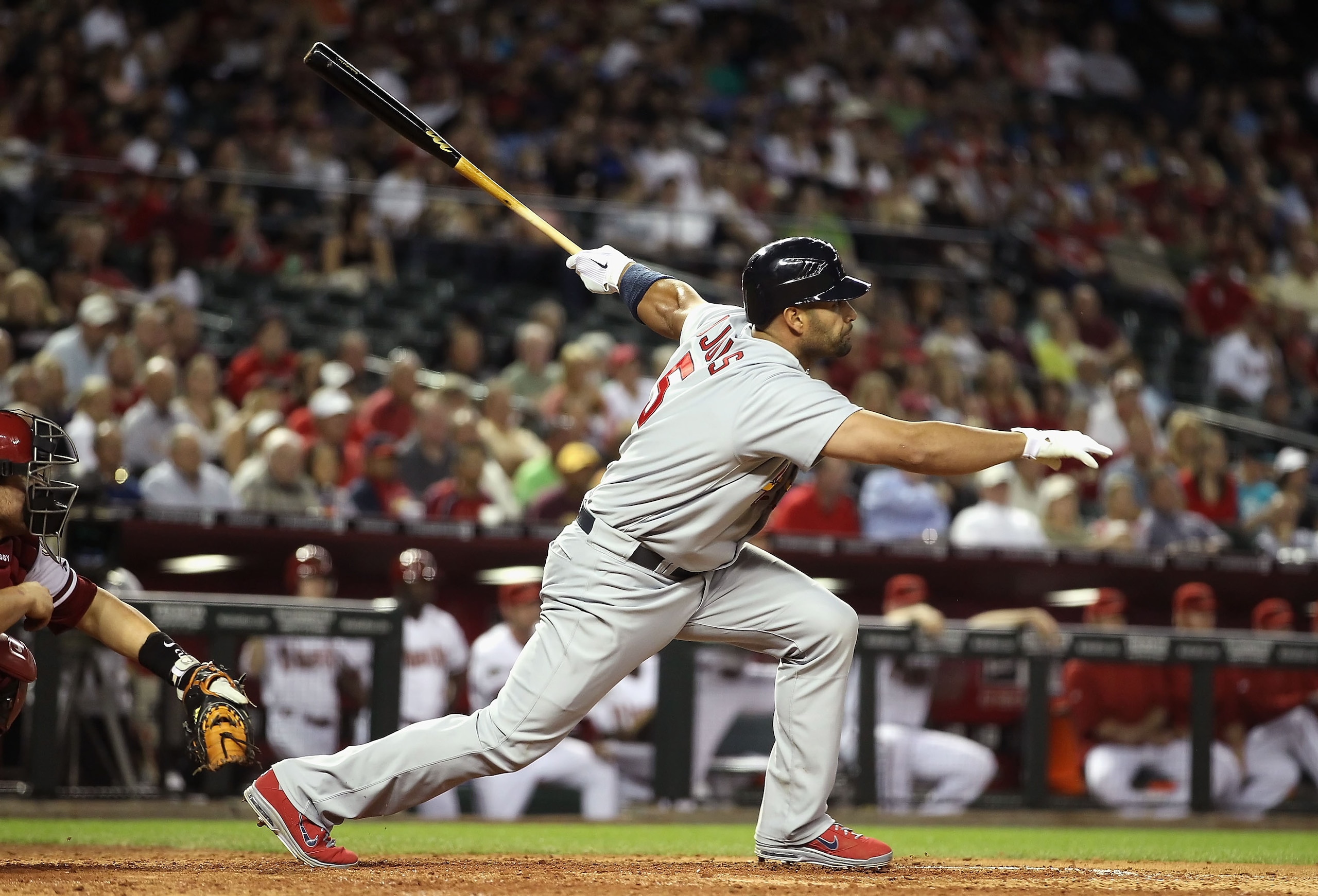 PHOENIX, AZ - APRIL 12:  Albert Pujols #5 of the St. Louis Cardinals hits a single against the Arizona Diamondbacks during the fifth inning of the Major League Baseball game at Chase Field on April 12, 2011 in Phoenix, Arizona.  (Photo by Christian Peters