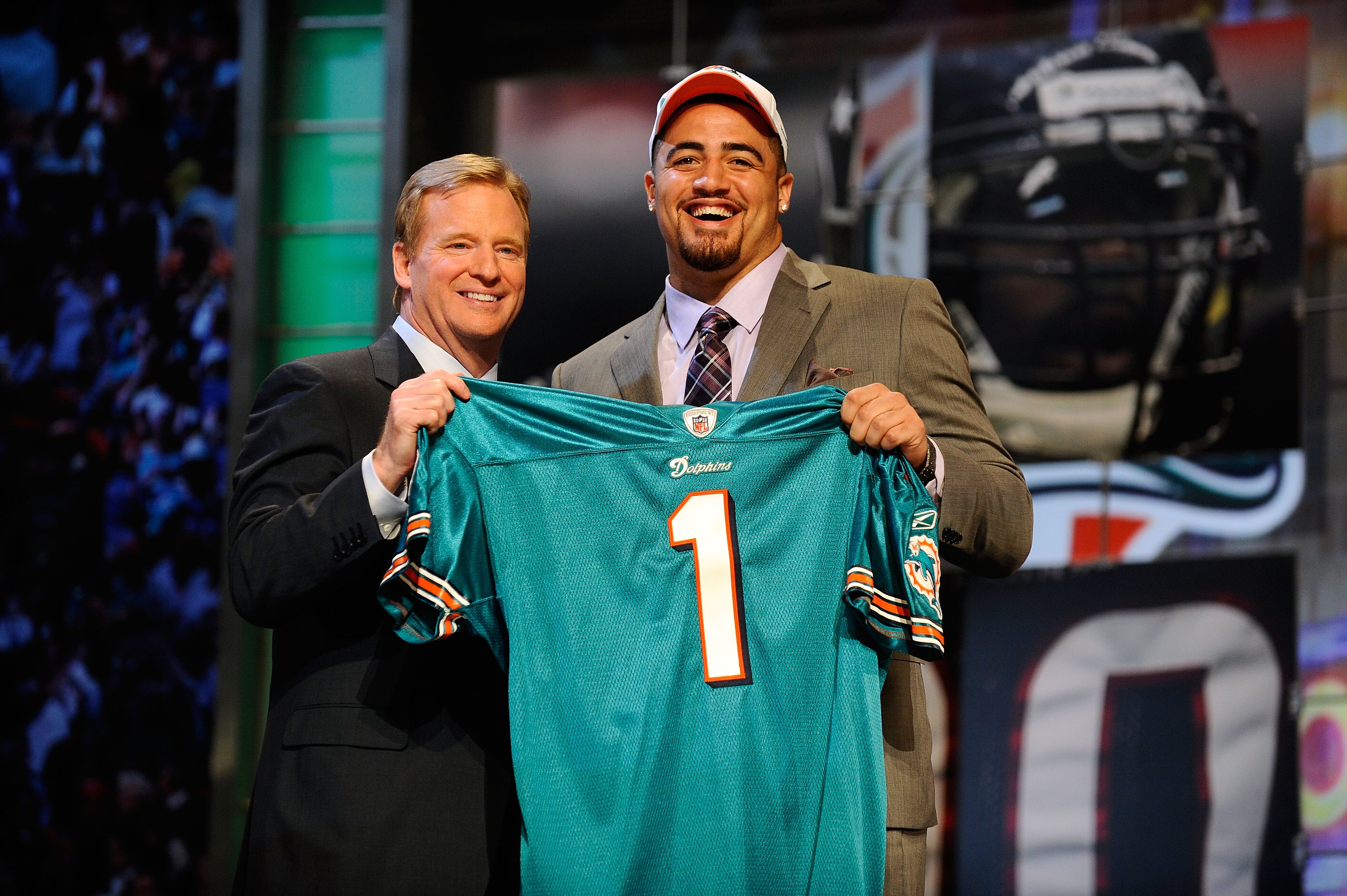 NEW YORK - APRIL 22:  Jared Odrick (R) from Penn State poses with NFL Commissioner Roger Goodell as they hold up a Miami Dolphins jersey after the Dolphins selected Odrick number 28 overall during the first round of the 2010 NFL Draft at Radio City Music