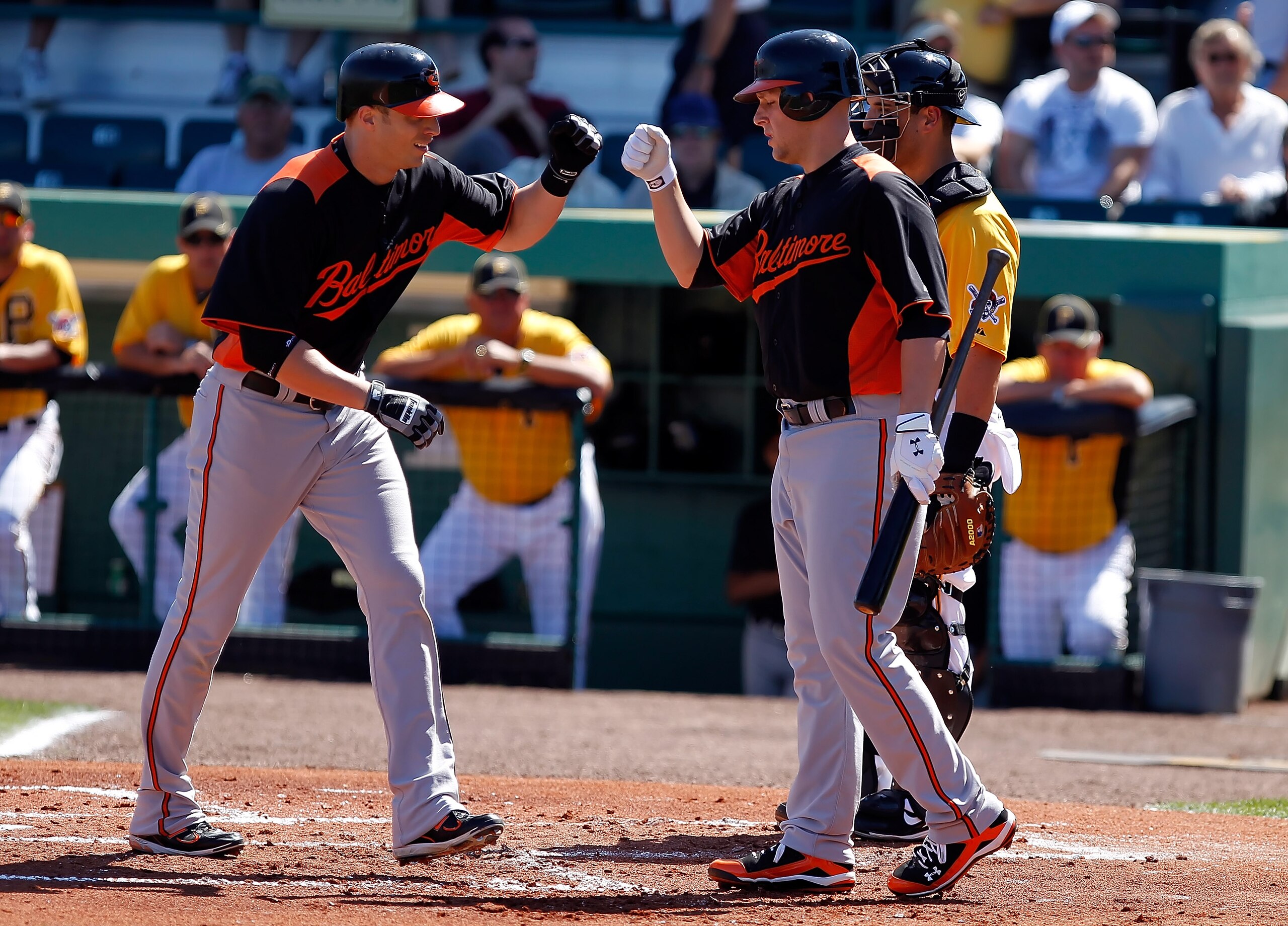 BRADENTON, FL - FEBRUARY 28: Outfielder Nolan Reimold #14 (left) of the Baltimore Orioles is congratulated by Brandon Snyder #29, after his second inning home run against the Pittsburgh Pirates during a Grapefruit League Spring Training Game at McKechnie BRADENTON, FL - FEBRUARY 28: Outfielder Nolan Reimold #14 (left) of the Baltimore Orioles is congratulated by Brandon Snyder #29, after his second inning home run against the Pittsburgh Pirates during a Grapefruit League Spring Training Game at McKechnie