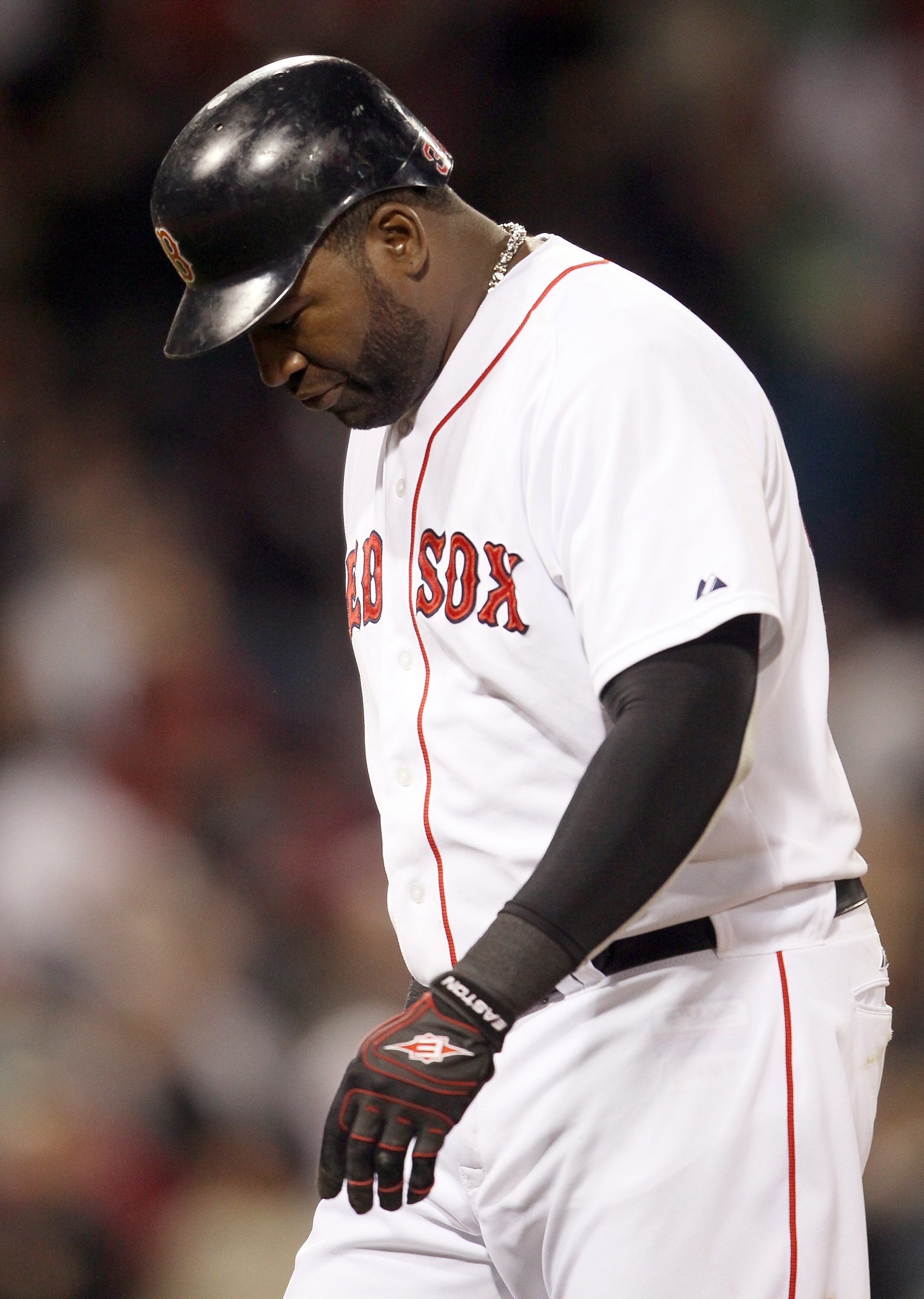 BOSTON, MA - APRIL 12:  David Ortiz #34 of the Boston Red Sox walks off the field after he hit a pop fly out to end the game against the Tampa Bay Rays on April 12, 2011 at Fenway Park in Boston, Massachusetts. The Tampa Bay Rays defeated the Boston Red S
