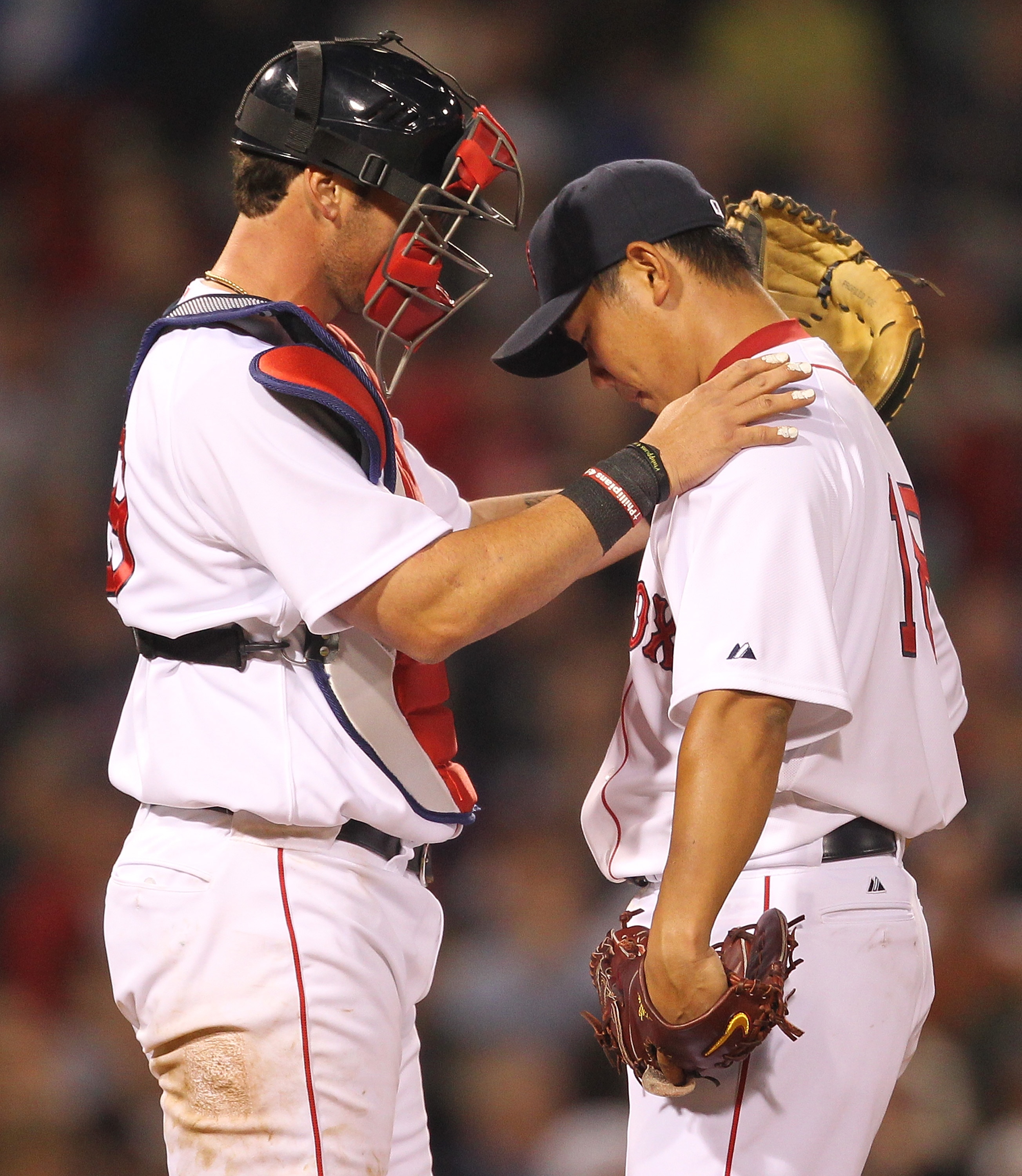 BOSTON, MA - APRIL 11:  Jarrod Saltalamacchia #39 consoles Daisuke Matsuzaka #18 of the Boston Red Sox after a six-run second inning against the Tampa Bay Rays at Fenway Park April 11, 2011 in Boston, Massachusetts. (Photo by Jim Rogash/Getty Images)