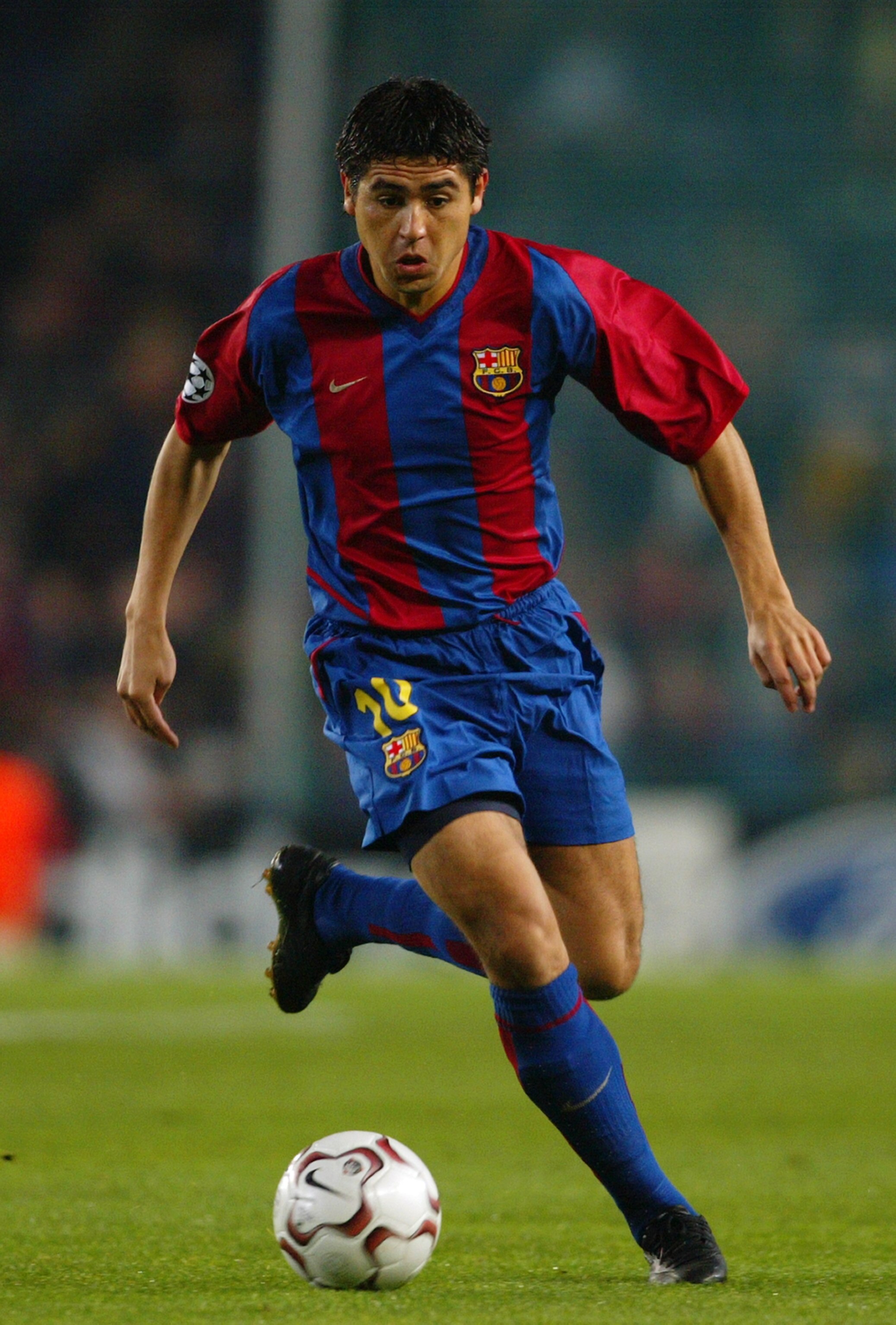 BARCELONA, SPAIN - DECEMBER 11:  Juan Roman Riquelme of Barcelona running with the ball at his feet during the match between Barcelona and Newcastle United in the UEFA Champions League, Second Phase, Group A match held on December 11, 2002 at the Nou Camp