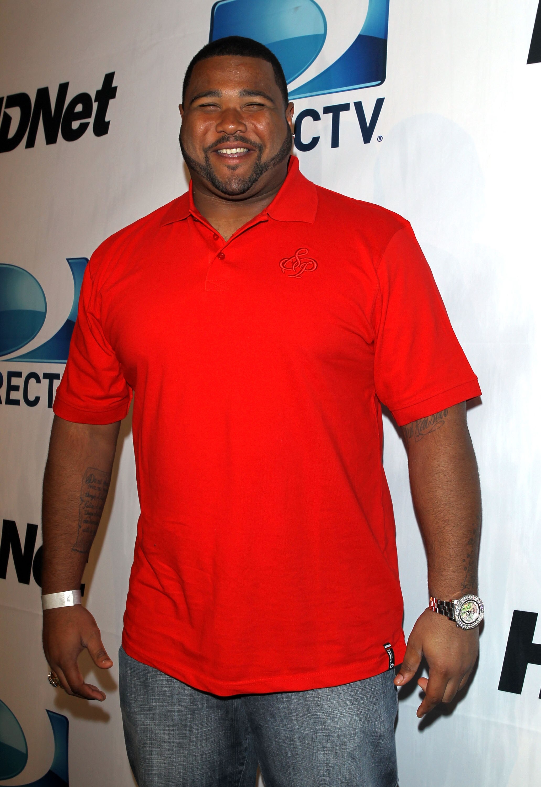 DALLAS, TX - FEBRUARY 05:  NFL player Carl Nicks of the New Orleans Saints arrives at Super Bowl Party hosted by DIRECTV and Mark Cuban's HDNet at Victory Park on February 5, 2011 in Dallas, Texas.  (Photo by Michael Tran/Getty Images for DIRECTV)