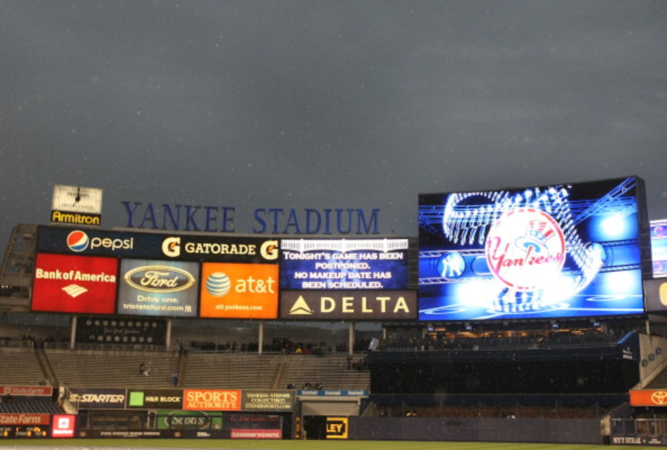 NEW YORK, NY - APRIL 12:  The scoreboard flashes that a game between the New York Yankees and Baltimore Orioles  is postponed due to rain on April 12, 2011 at Yankee Stadium in the Bronx borough of New York City.   (Photo by Al Bello/Getty Images)
