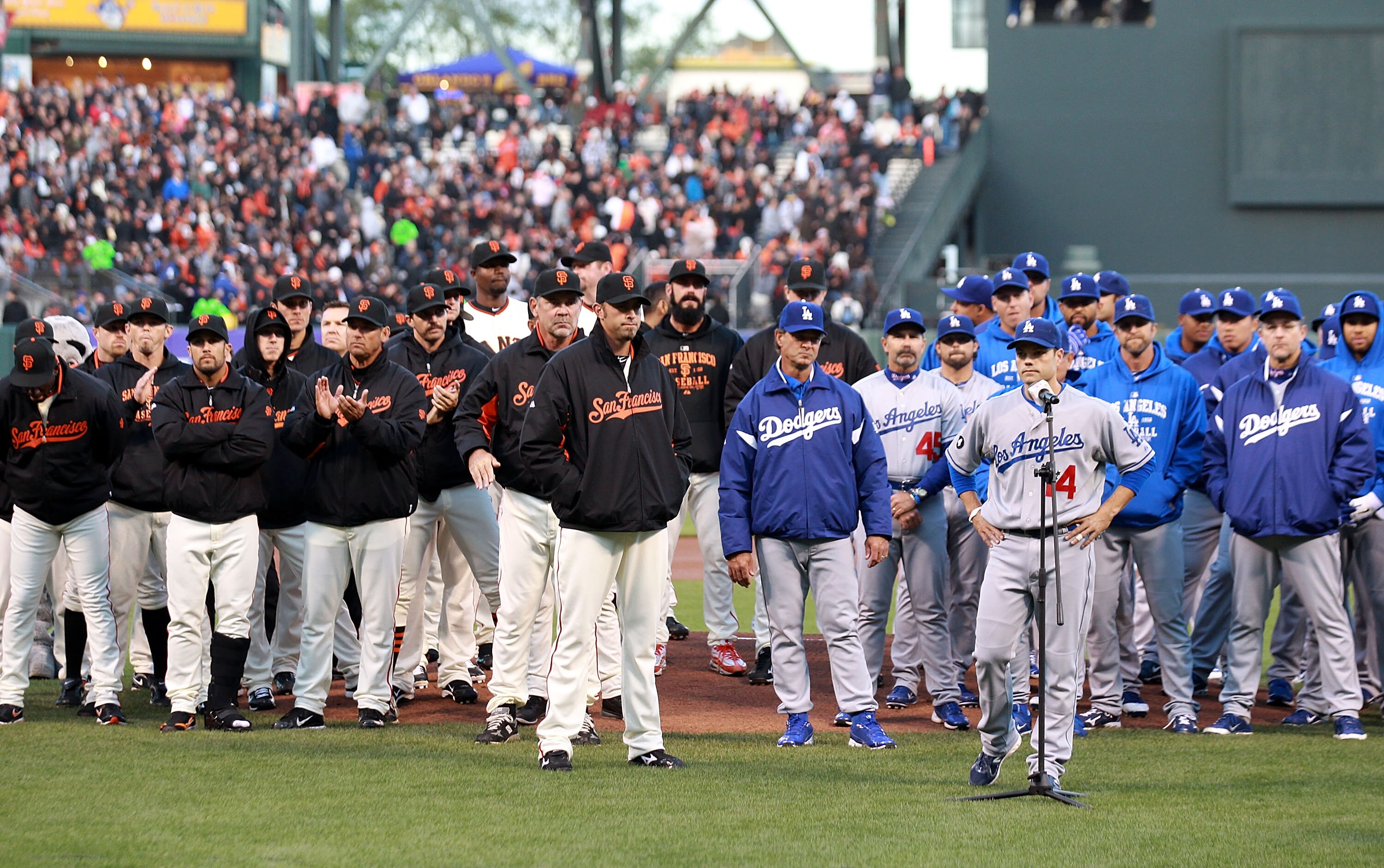 SAN FRANCISCO, CA - APRIL 11:  Jamey Carroll #14 of the Los Angeles Dodgers  speaks about about Brian Stow, the Giants fan who was attacked last week at a Dodgers game in Los Angeles, before an MLB game at AT&T Park on April 11, 2011 in San Francisco, Cal