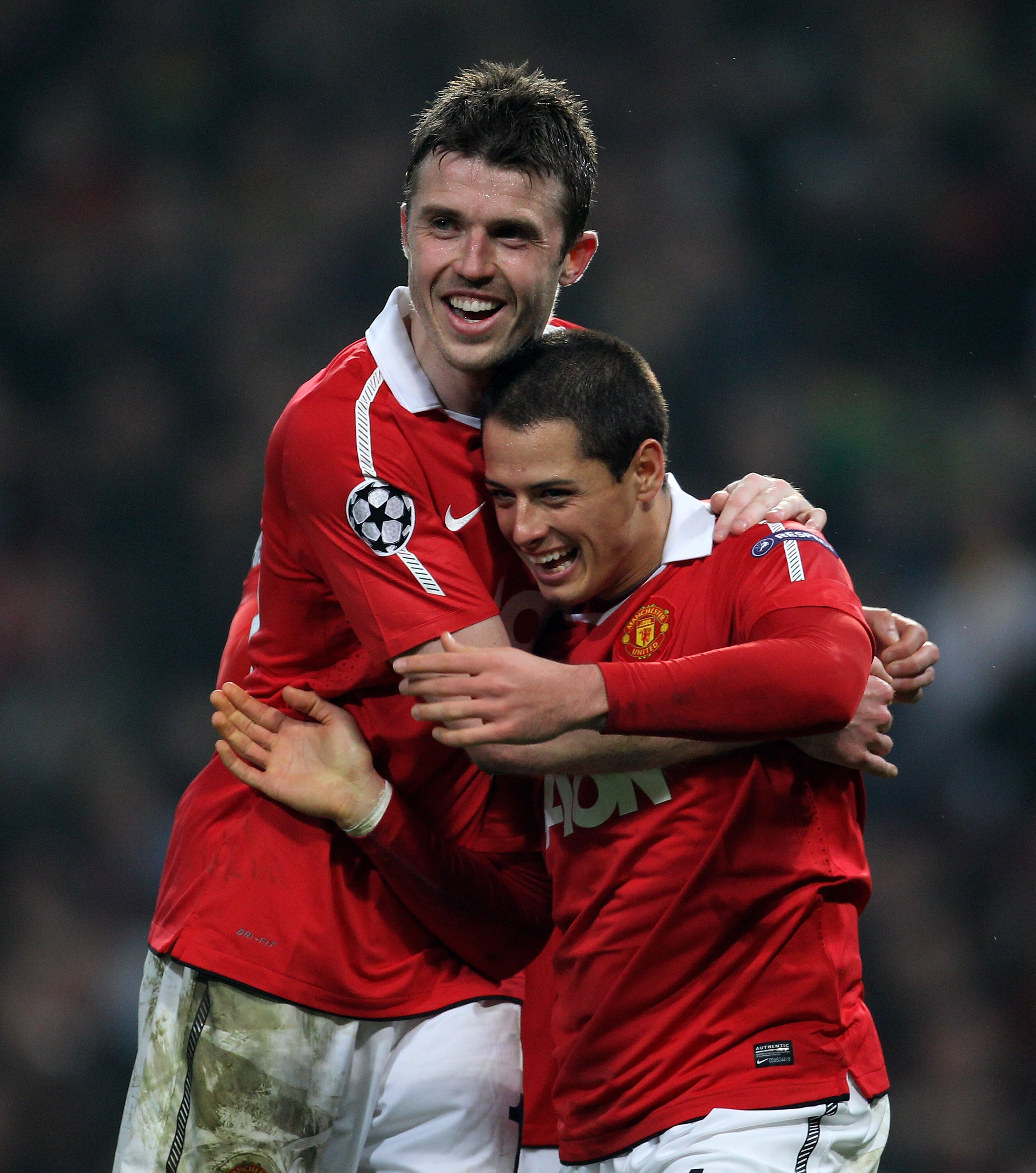 MANCHESTER, ENGLAND - MARCH 15:  Javier Hernandez (R) of Manchester United celebrates with teammate Michael Carrick as he scores the second goal during the UEFA Champions League round of 16 second leg match between Manchester United and Marseille at Old T