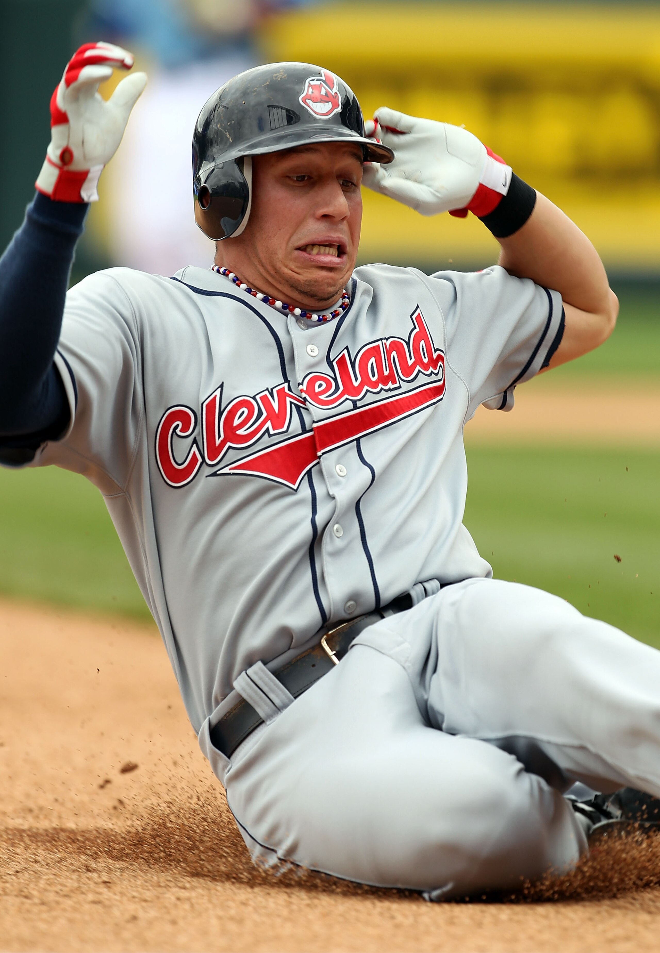 KANSAS CITY, MO - MAY 13:  Shortstop Asdrubal Cabrera #13 of the Cleveland Indians slides into third for a triple during the 1st inning of the game against the Kansas City Royals on May 13, 2010 at Kauffman Stadium in Kansas City, Missouri.  (Photo by Jam