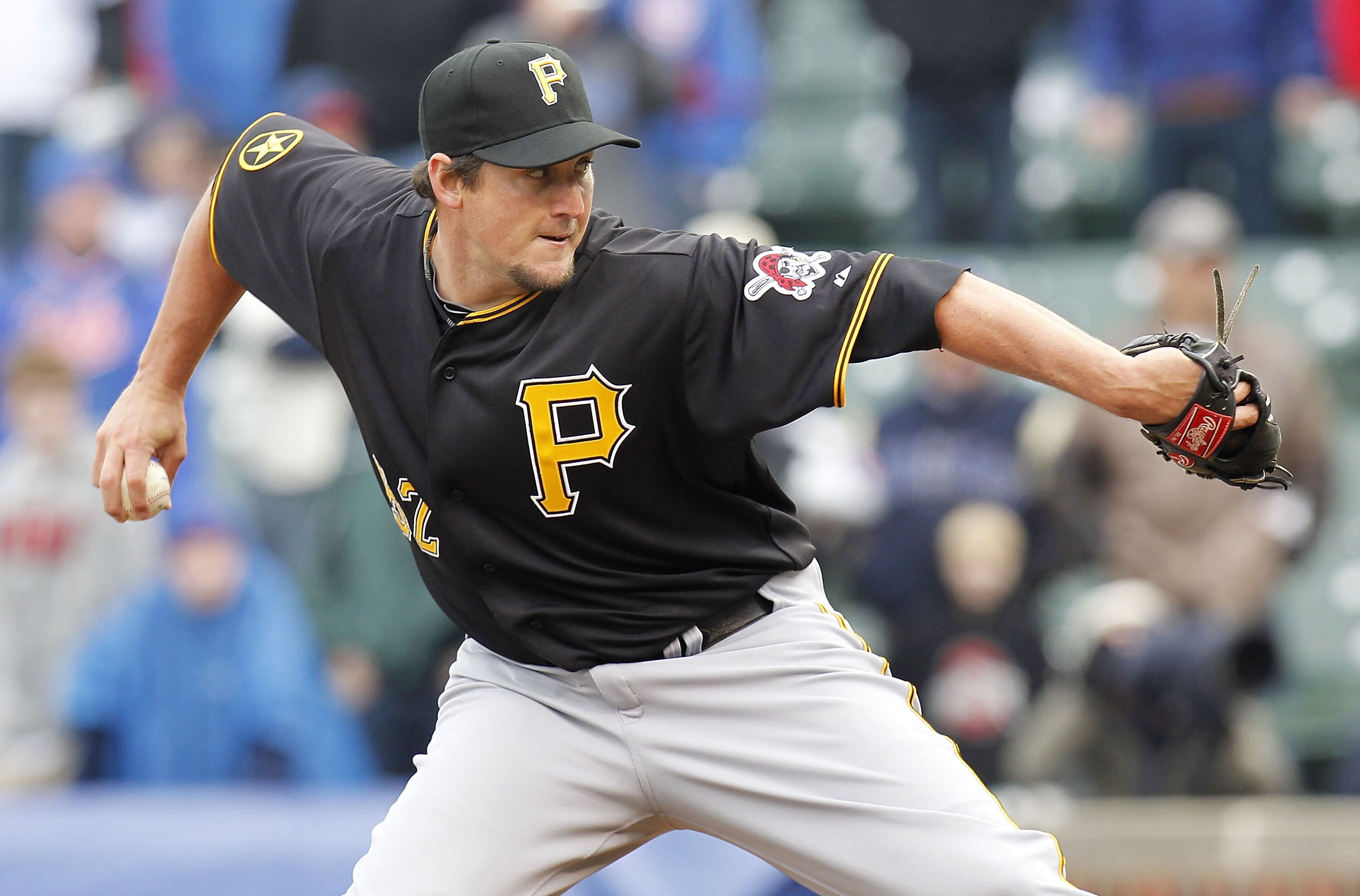 CHICAGO, IL - APRIL 01:  Joel Hanrahan #52 of the Pittsburgh Pirates throws a ninth inning pitch while playing the Chicago Cubs during opening day at Wrigley Field on April 1, 2011 in Chicago, Illinois. Pittsburgh won the game 6-3.  (Photo by Gregory Sham
