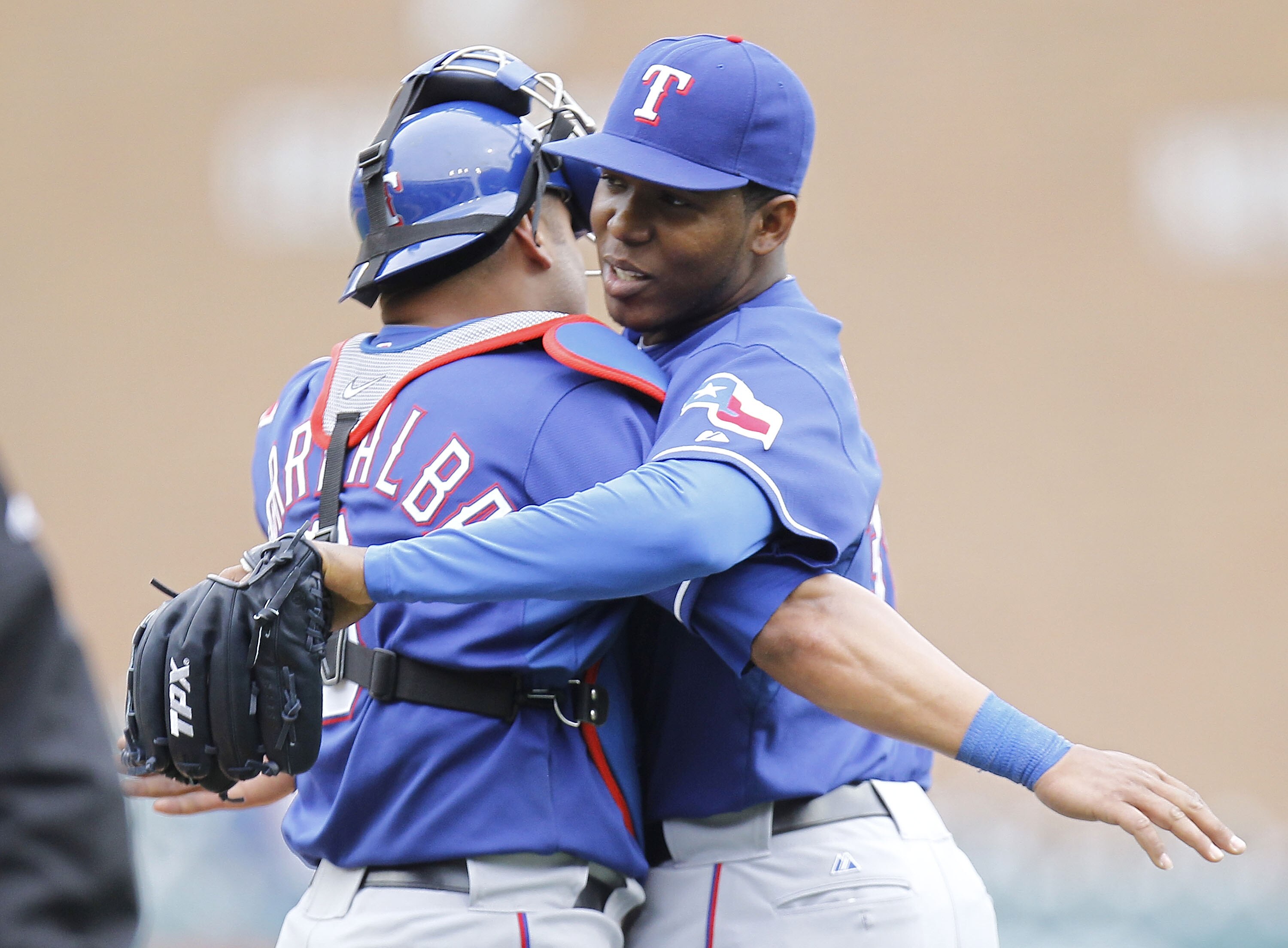 DETROIT, MI - APRIL 11:  Neftali Feliz #30 of the Texas Rangers celebrates a 2-0 win over the Detroit Tigers with Yorvit Torrealba #8 at Comerica Park on April 11, 2011 in Detroit, Michigan.  (Photo by Gregory Shamus/Getty Images)