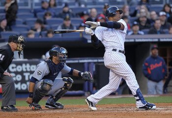 NEW YORK, NY - APRIL 02: Robinson Cano #24 of the New York Yankees hits a double against the Detroit Tigers at Yankee Stadium on April 2, 2011 in the Bronx borough of New York City.  (Photo by Nick Laham/Getty Images)