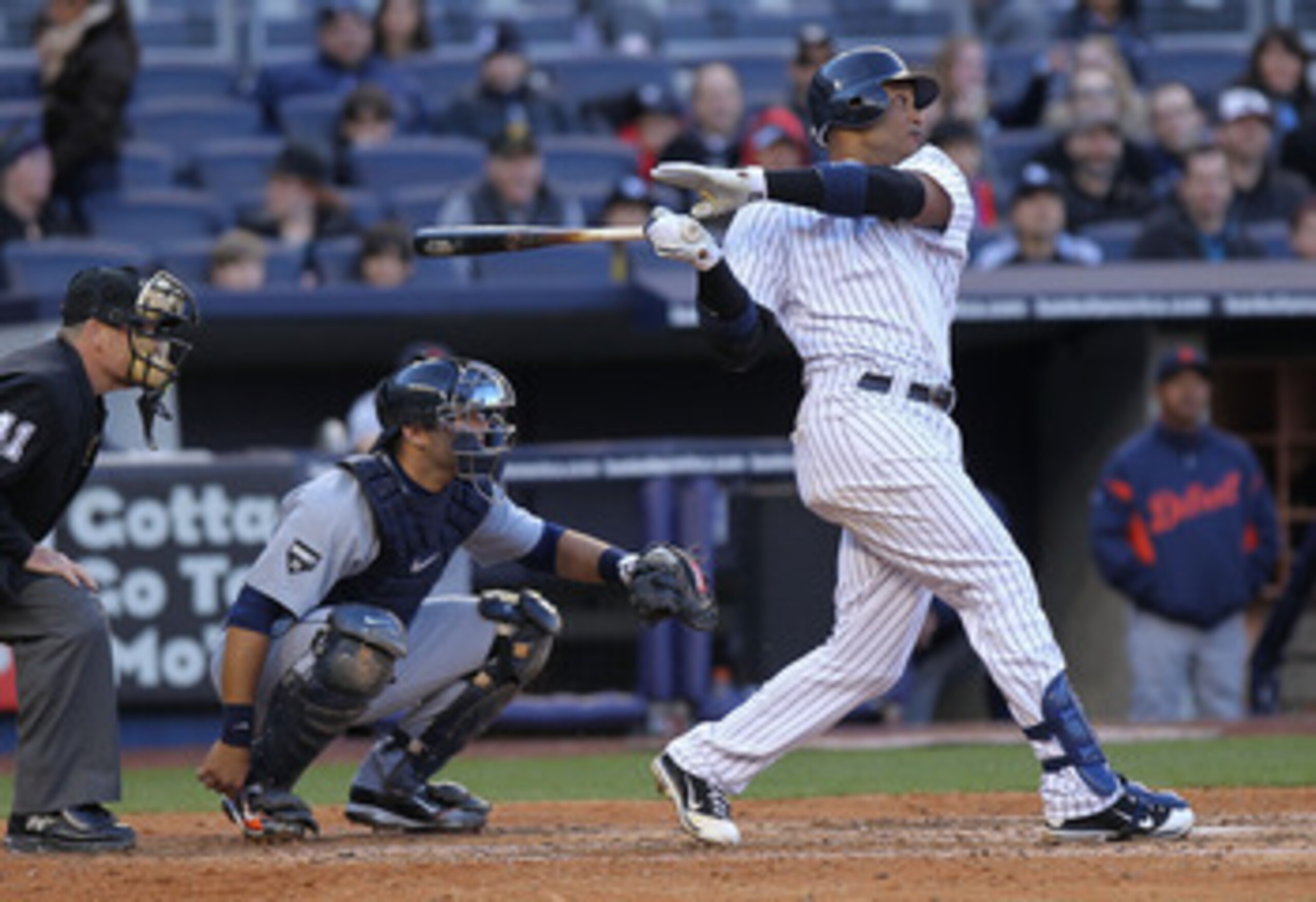 NEW YORK, NY - APRIL 02: Robinson Cano #24 of the New York Yankees hits a double against the Detroit Tigers at Yankee Stadium on April 2, 2011 in the Bronx borough of New York City.  (Photo by Nick Laham/Getty Images)