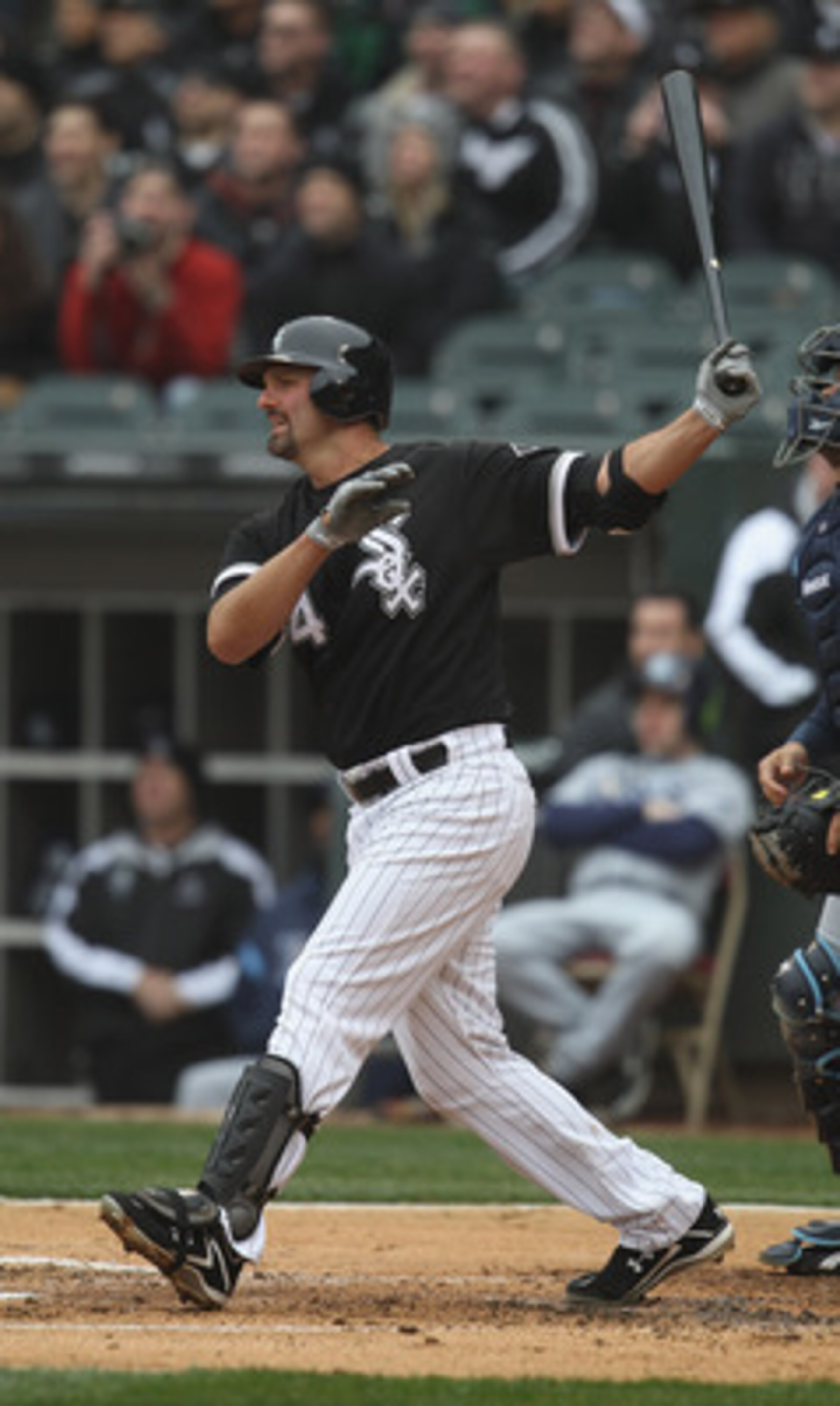 CHICAGO, IL - APRIL 07: Paul Konerko #14 of the Chicago White Sox hits the ball against the Tampa Bay Rays during the home opener at U.S. Cellular Field on April 7, 2011 in Chicago, Illinois. The White Sox defeated the Rays 5-1. (Photo by Jonathan Daniel/