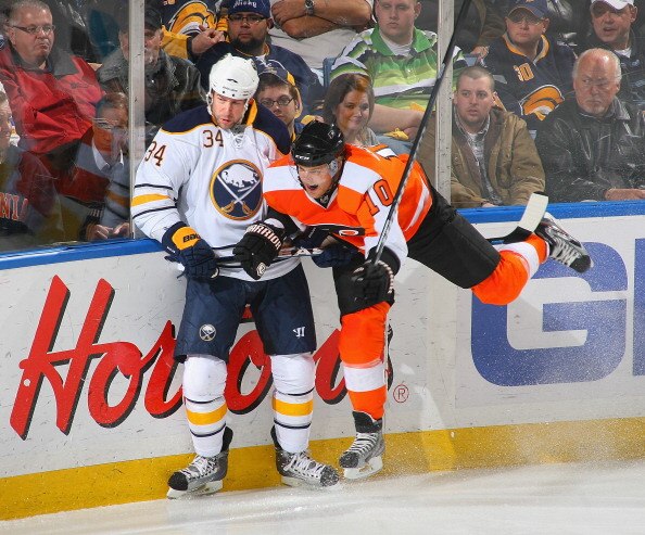 BUFFALO, NY - APRIL 08: Chris Butler #34  of the Buffalo Sabres collides with Kris Versteeg #10 of the Philadelphia Flyers at HSBC Arena on April 8, 2011 in Buffalo, New York.  (Photo by Rick Stewart/Getty Images)