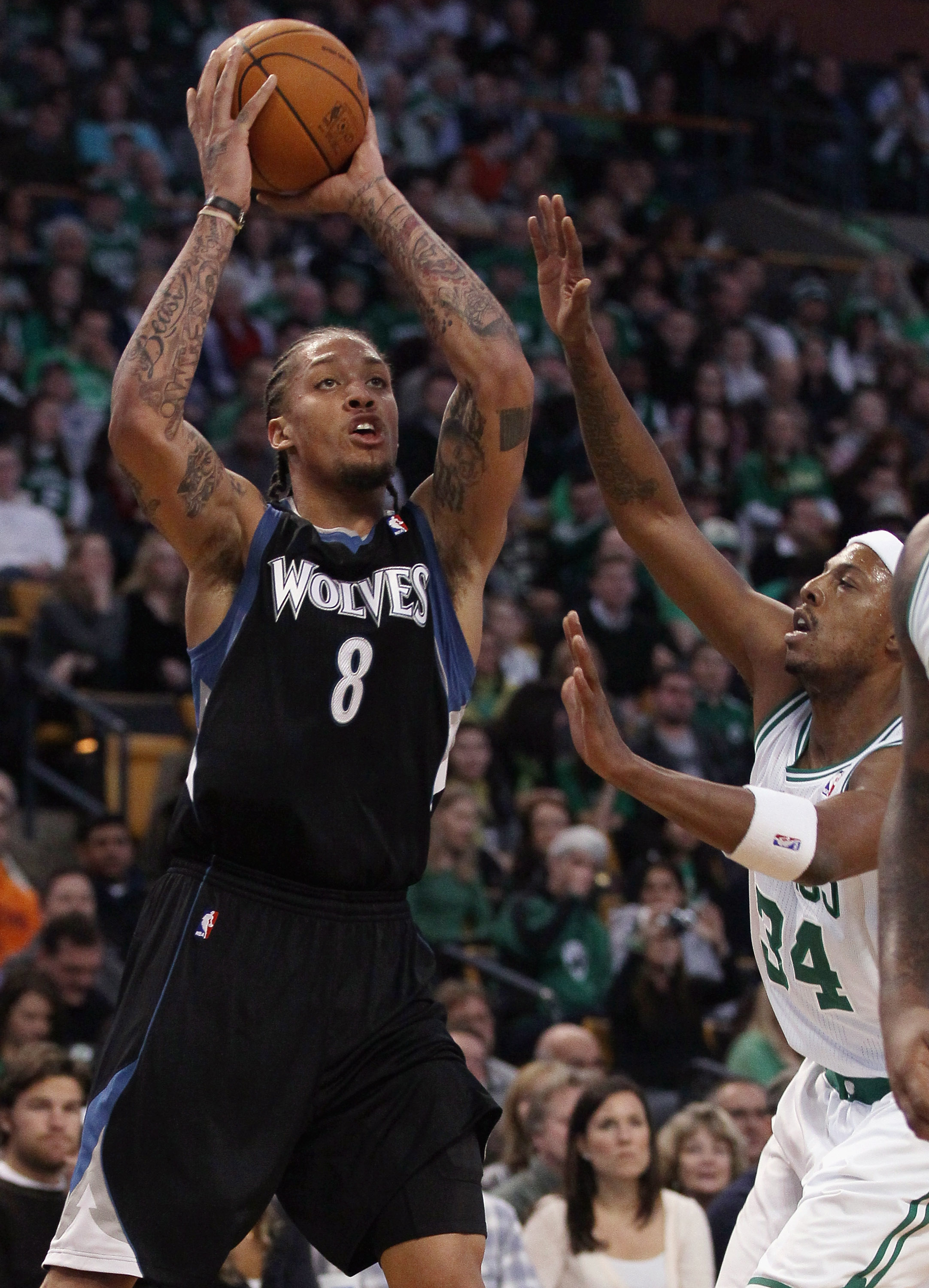 BOSTON, MA - JANUARY 03:  Michael Beasley #8 of the Minnesota Timberwolves takes a shot as Paul Pierce #34 of the Boston Celtics defends on January 3, 2011 at the TD Garden in Boston, Massachusetts. NOTE TO USER: User expressly acknowledges and agrees tha