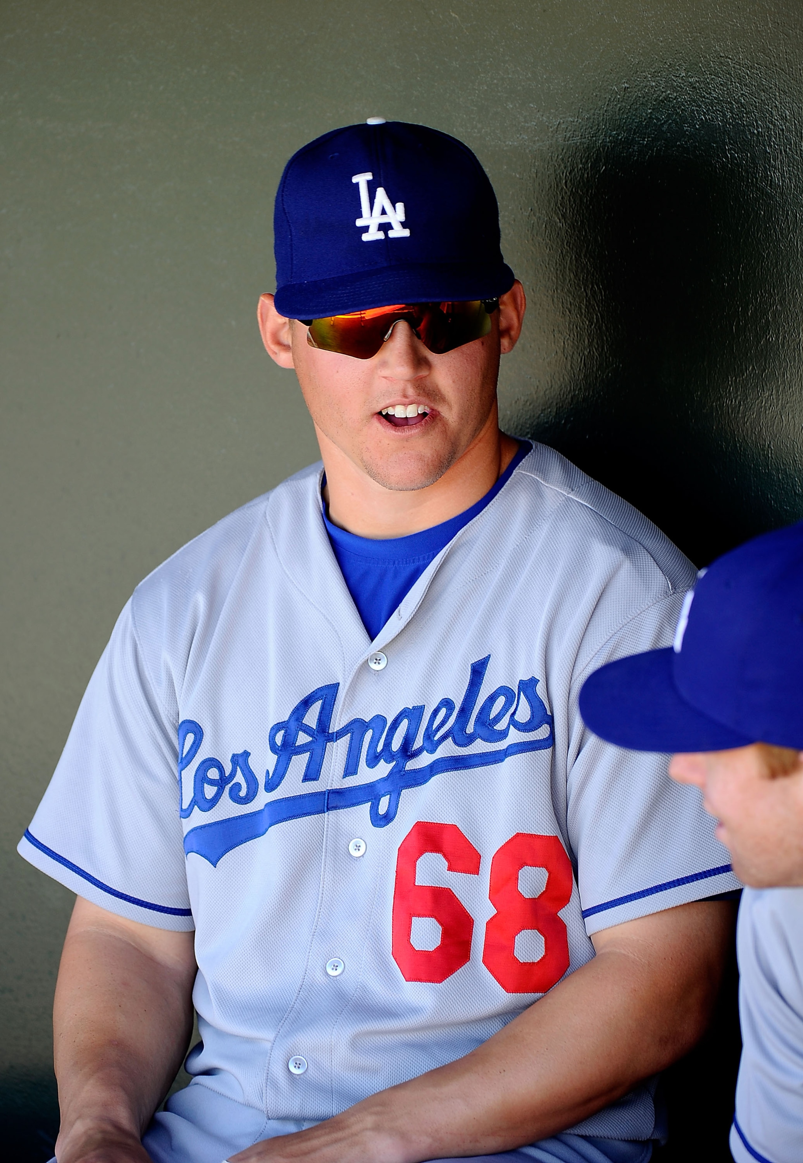 SURPRISE, AZ - MARCH 12:  Jerry Sands #68 of the Los Angeles Dodgers sits in the dug out before the spring training baseball game against the Kansas City Royals at Surprise Stadium on March 12, 2011 in Surprise, Arizona.  (Photo by Kevork Djansezian/Getty