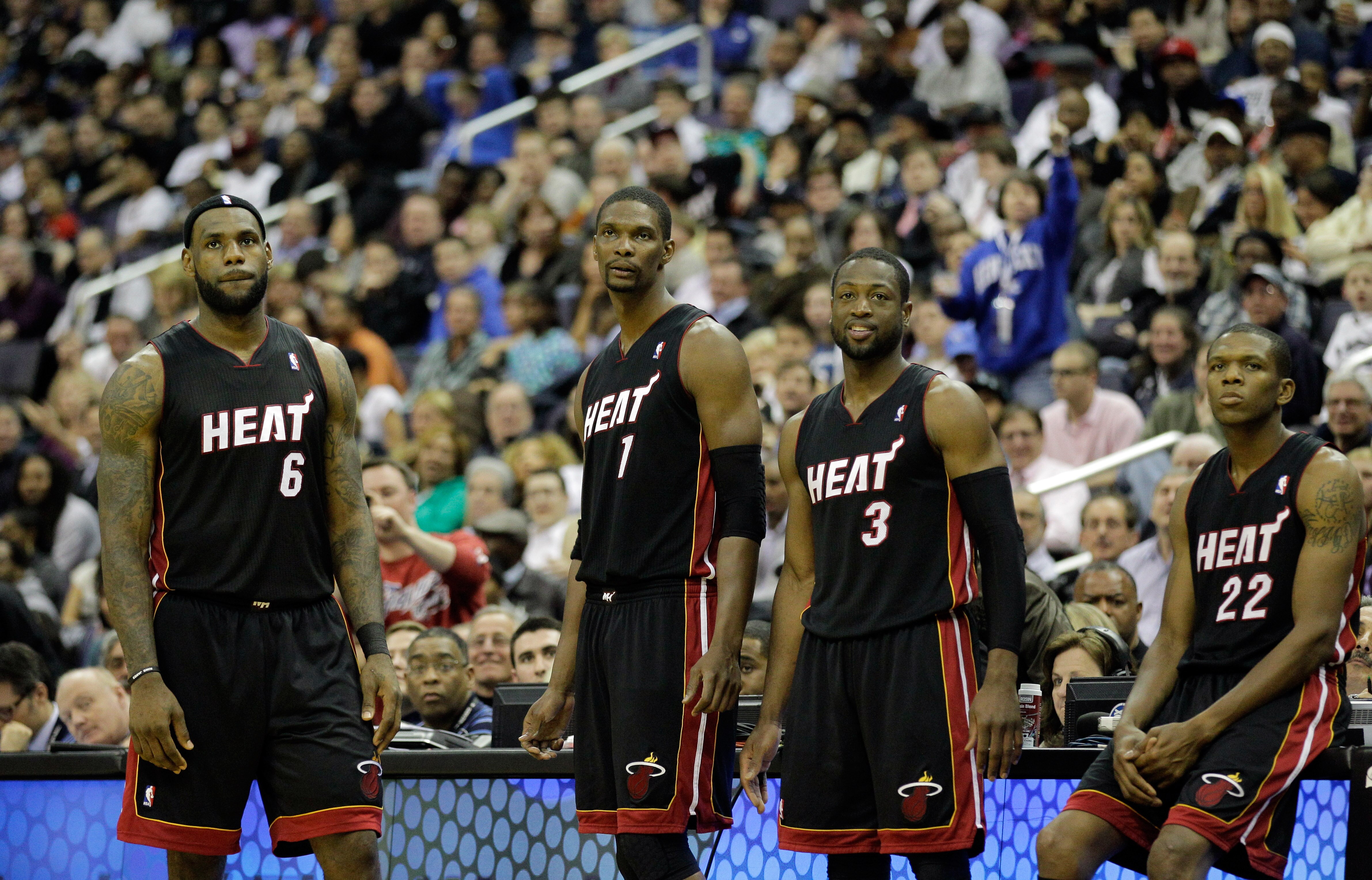 WASHINGTON, DC - MARCH 30:  LeBron James #6 of the Miami Heat stands with teammates Chris Bosh #1,  Dwyane Wade #3, and James Jones #22 against the Washington Wizards at the Verizon Center on March 30, 2011 in Washington, DC. NOTE TO USER: User expressly