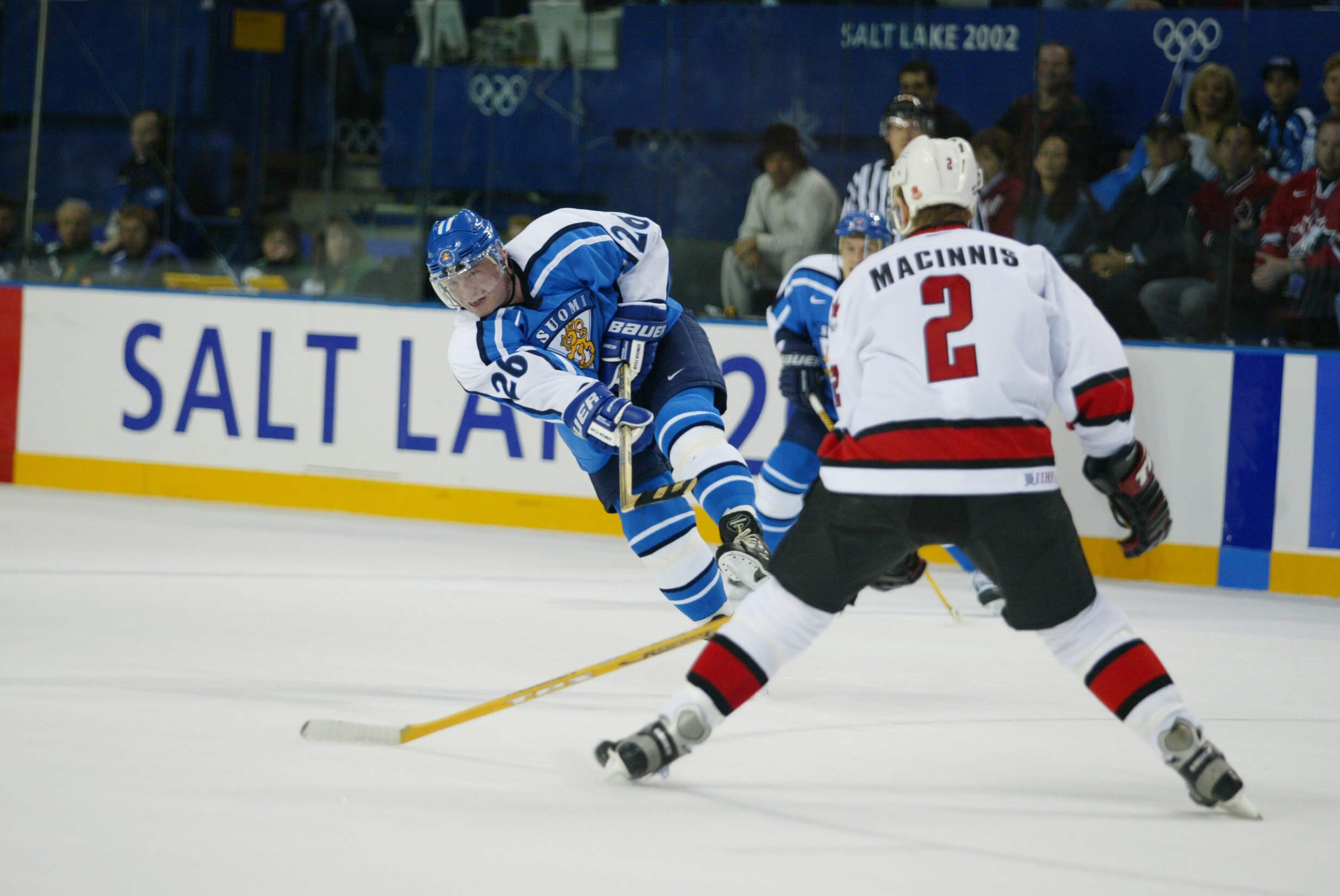 20 Feb 2002: Jere Lehtinen #26 of Finland lets go a shot that Al MacInnis #2 of Canada prepares to block during the men's quarterfinals at the Salt Lake City Winter Olympic Games at the E Center in Salt Lake City, Utah. DIGITAL IMAGE. Mandatory Credit: