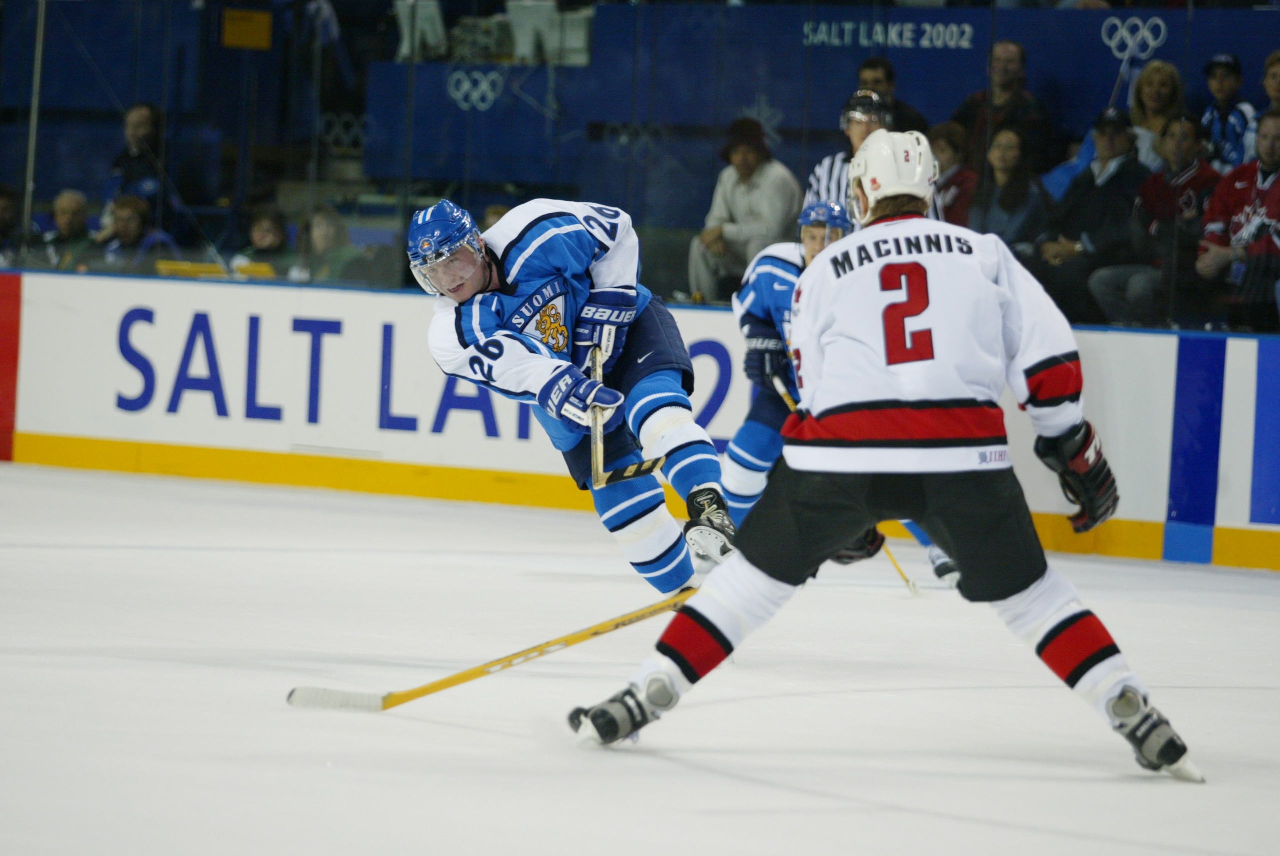 20 Feb 2002: Jere Lehtinen #26 of Finland lets go a shot that Al MacInnis #2 of Canada prepares to block during the men's quarterfinals at the Salt Lake City Winter Olympic Games at the E Center in Salt Lake City, Utah. DIGITAL IMAGE. Mandatory Credit: