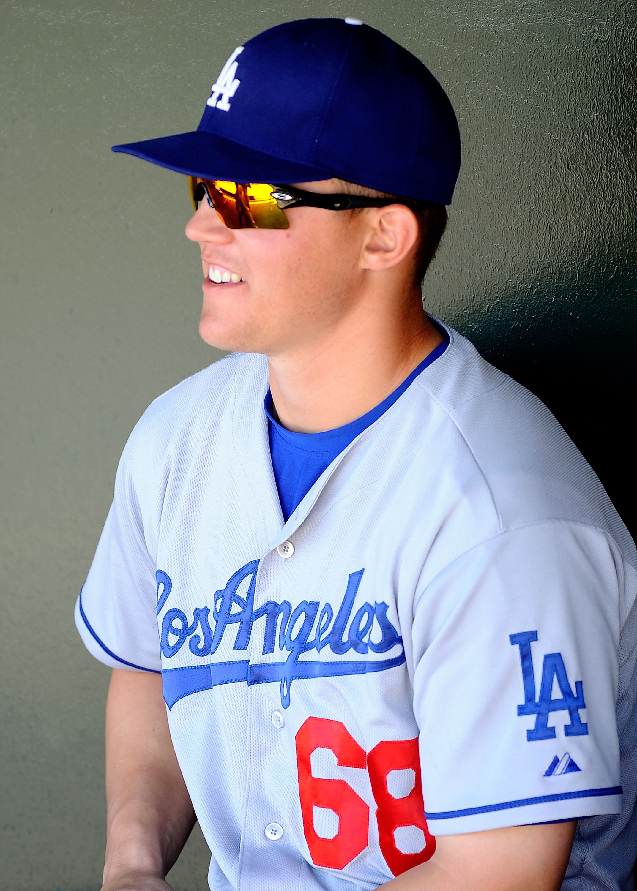 SURPRISE, AZ - MARCH 12:  Jerry Sands #68 of the Los Angeles Dodgers sits in the dug out before the spring training baseball game against the Kansas City Royals at Surprise Stadium on March 12, 2011 in Surprise, Arizona.  (Photo by Kevork Djansezian/Getty