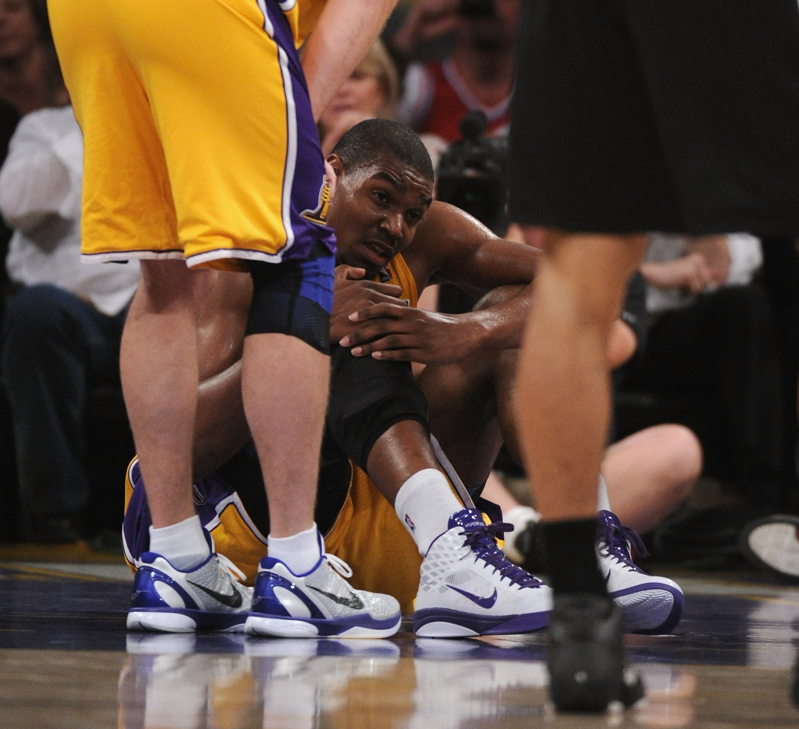 LOS ANGELES, CA - APRIL 12:  Andrew Bynum #17 of the Los Angeles Lakers grimaces after an injury against the San Antonio Spurs at Staples Center on April 12, 2011 in Los Angeles, California.  NOTE TO USER: User expressly acknowledges and agrees that, by d