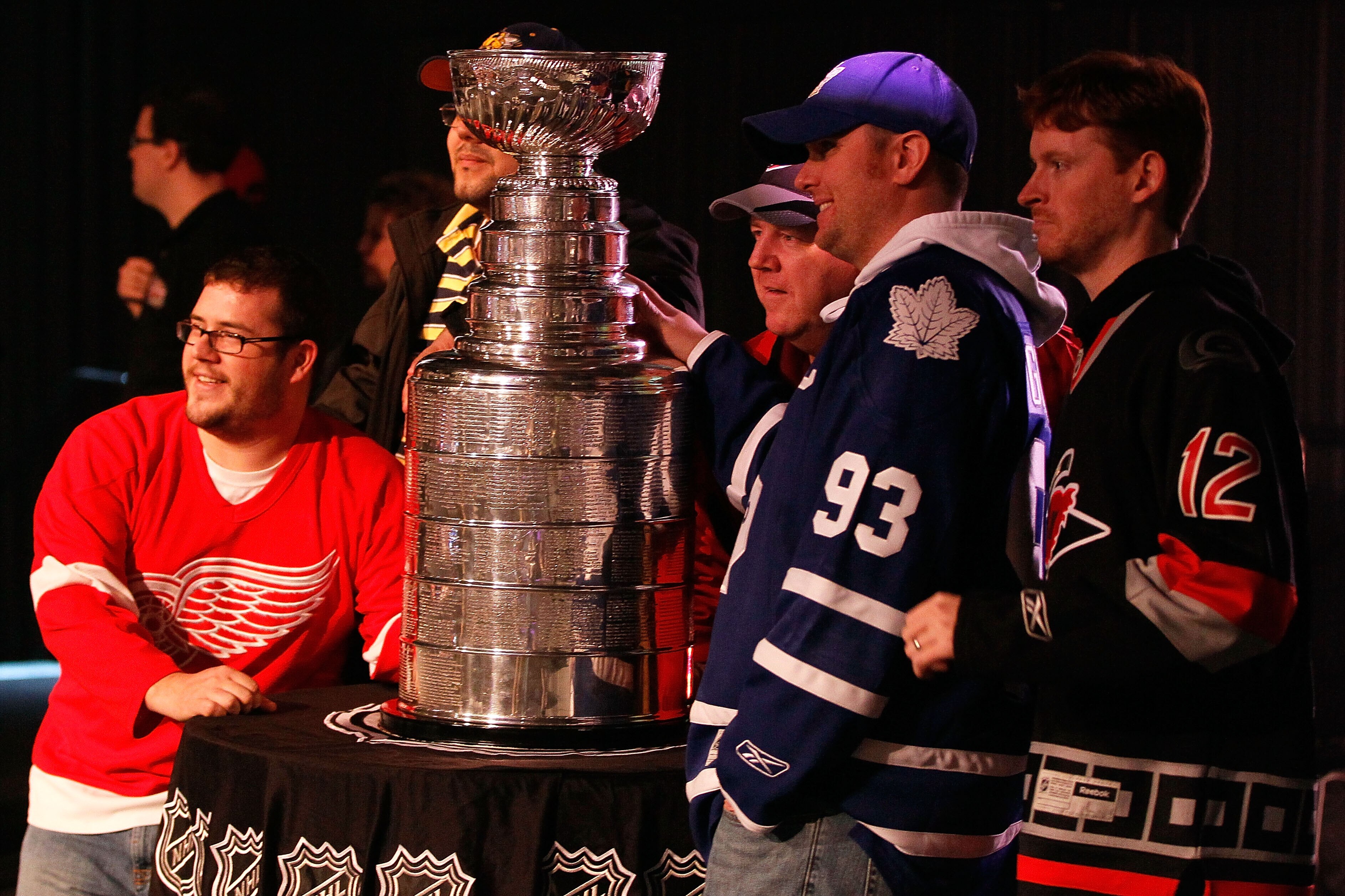 RALEIGH, NC - JANUARY 28:  Hockey fans pose with the Stanley Cup inside the NHL Fan Fair part of 2011 NHL All-Star Weekend at the Raleigh Convention Center on January 28, 2011 in Raleigh, North Carolina.  (Photo by Kevin C. Cox/Getty Images)