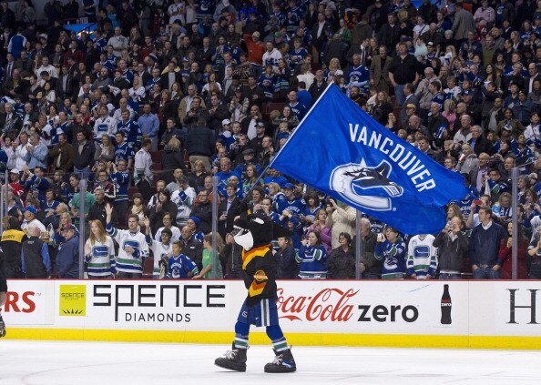 VANCOUVER, CANADA - APRIL 7: Fin, mascot of the Vancouver Canucks waves a team flag on the ice after the Vancouver Canucks defeated the Minnesota Wild in NHL action on April 07, 2011 at Rogers Arena in Vancouver, BC, Canada.  (Photo by Rich Lam/Getty Imag