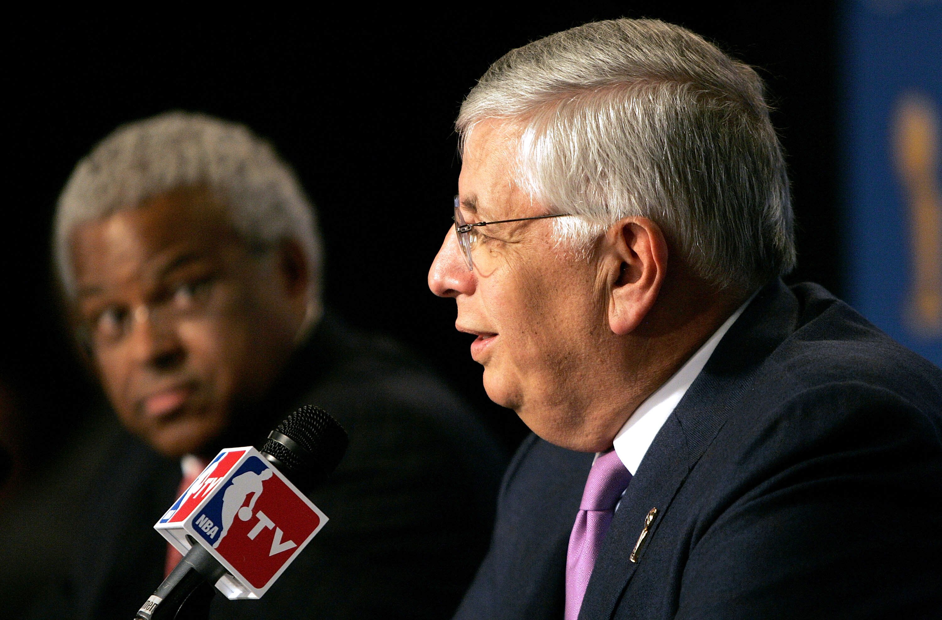 SAN ANTONIO - JUNE 21:  (L-R) Billy Hunter, President of the NBA Players Association, looks on as NBA commissioner David Stern speaks at a press conference announcing that the NBA and the NBA Players Association have agreed in principal on a new 6-year Co