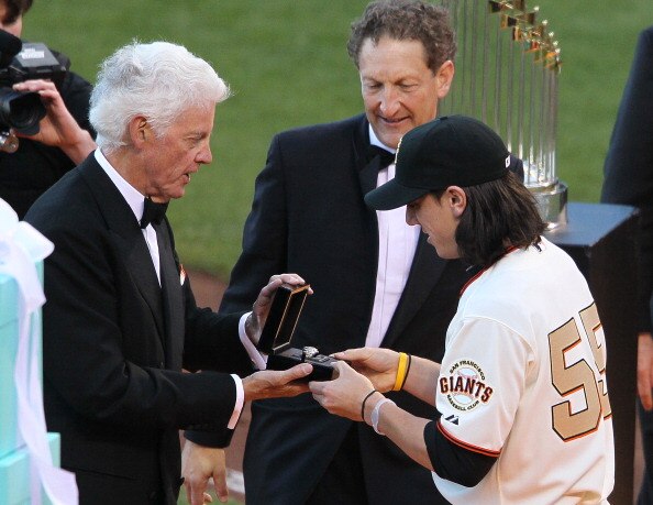 SAN FRANCISCO, CA - APRIL 09:  Tim Lincecum #55 of the San Francisco Giants receives his World Series ring from Giants owner Bill Neukom (L) and Giants President Larry Baer before the start of the game against the St. Louis Cardinals at AT&T Park on April