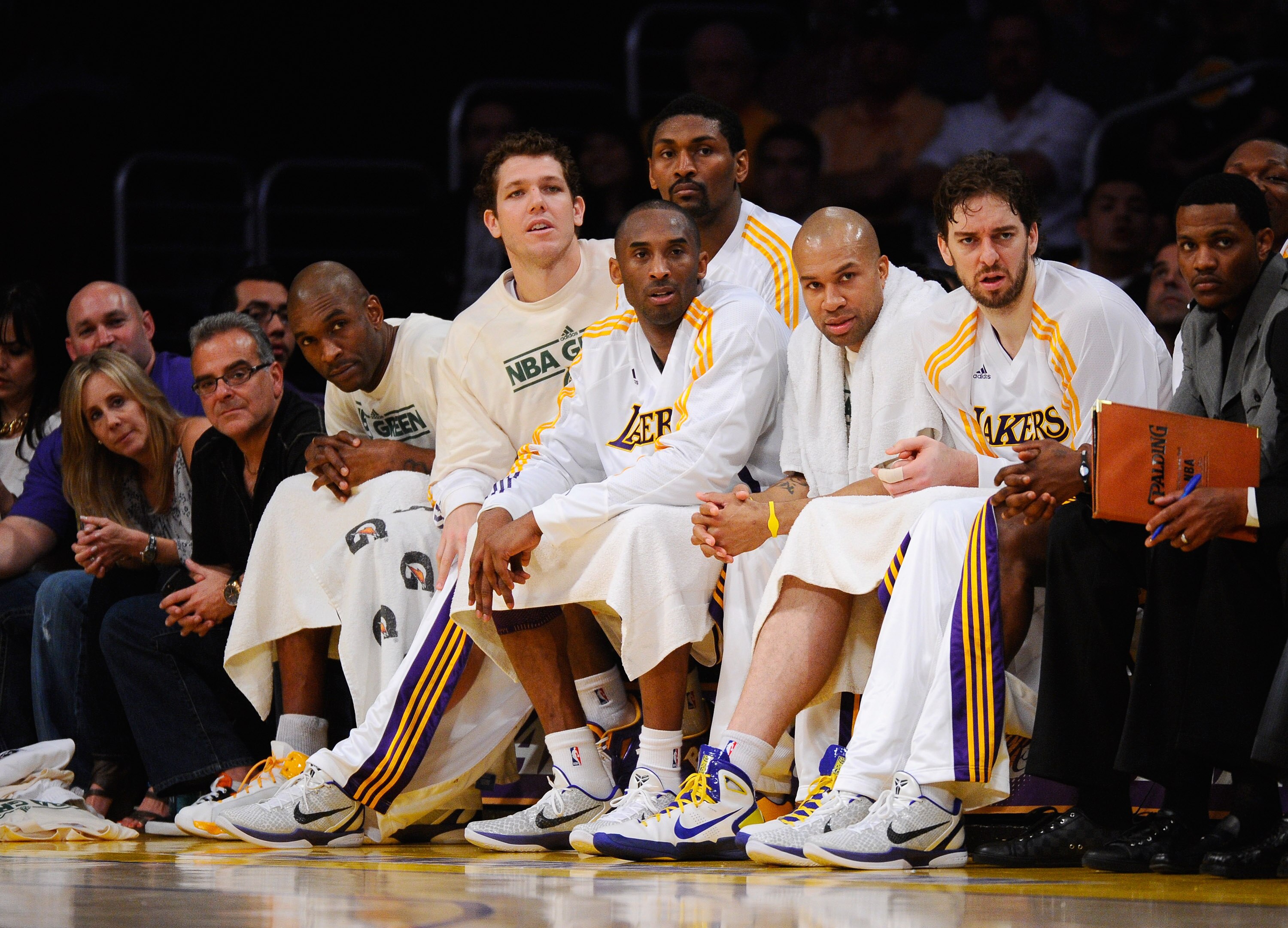LOS ANGELES, CA - APRIL 03:  (L-R) Joe Smith #1, Luke Walton #4, Ron Artest #15, Kobe Bryant #24, Derek Fisher #2 and Pau Gasol #16 of the Los Angeles Lakers watch from the bench during the game against Denver Nuggets at Staples Center on April 3, 2011 in