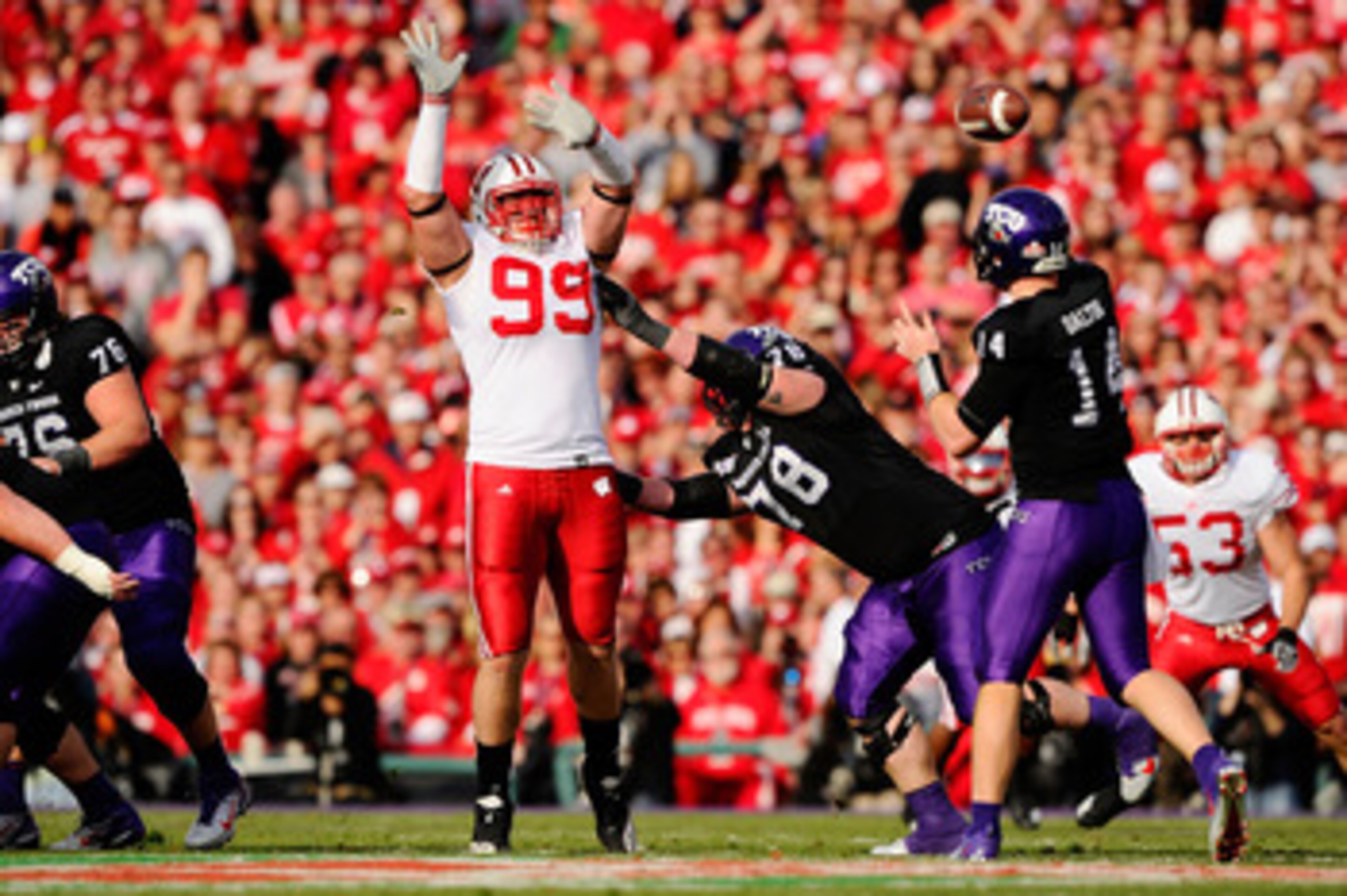 PASADENA, CA - JANUARY 01: Defensive lineman J.J. Watt #99 of the Wisconsin Badgers defends a pass by quarterback Andy Dalton #14 of the TCU Horned Frogs during the 97th Rose Bowl game on January 1, 2011 in Pasadena, California. (Photo by Kevork Djansez PASADENA, CA - JANUARY 01: Defensive lineman J.J. Watt #99 of the Wisconsin Badgers defends a pass by quarterback Andy Dalton #14 of the TCU Horned Frogs during the 97th Rose Bowl game on January 1, 2011 in Pasadena, California. (Photo by Kevork Djansez