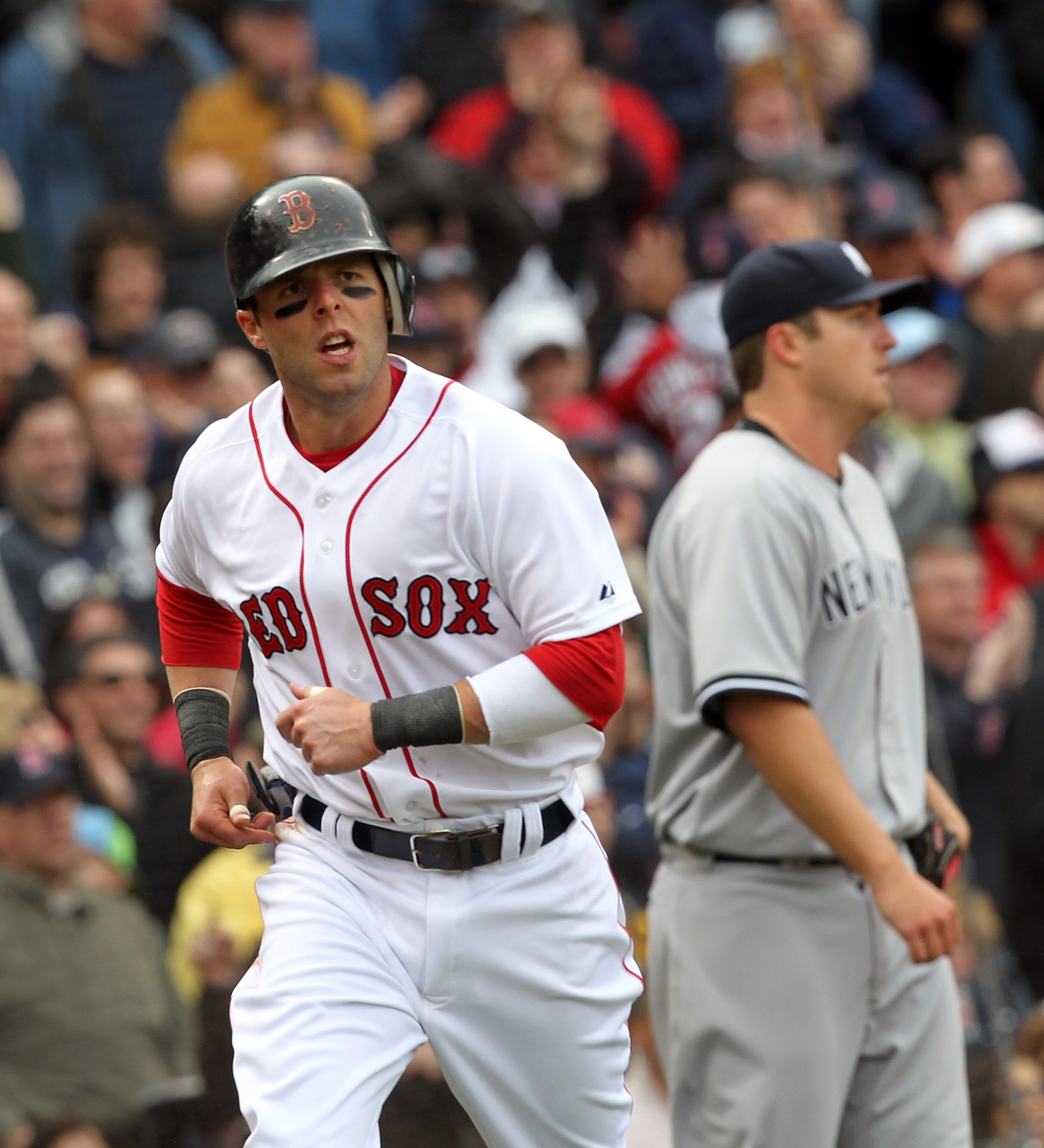 BOSTON, MA - APRIL 8: Dustin Pedroia # 15 of the Boston Red Sox scores a run against Phil Hughes #65 of the New York Yankees in the second inning on Opening Day at Fenway Park on April 8, 2011 in Boston, Massachusetts. (Photo by Jim Rogash/Getty Images BOSTON, MA - APRIL 8: Dustin Pedroia # 15 of the Boston Red Sox scores a run against Phil Hughes #65 of the New York Yankees in the second inning on Opening Day at Fenway Park on April 8, 2011 in Boston, Massachusetts. (Photo by Jim Rogash/Getty Images