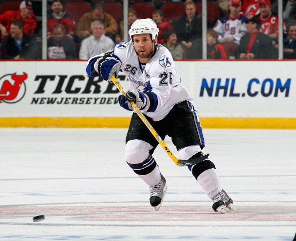 NEWARK, NJ - MARCH 02:  Martin St. Louis #26 of the Tampa Bay Lightning passes during an NHL hockey game against the New Jersey Devils at the Prudential Center on March 2, 2011 in Newark, New Jersey.  (Photo by Paul Bereswill/Getty Images)