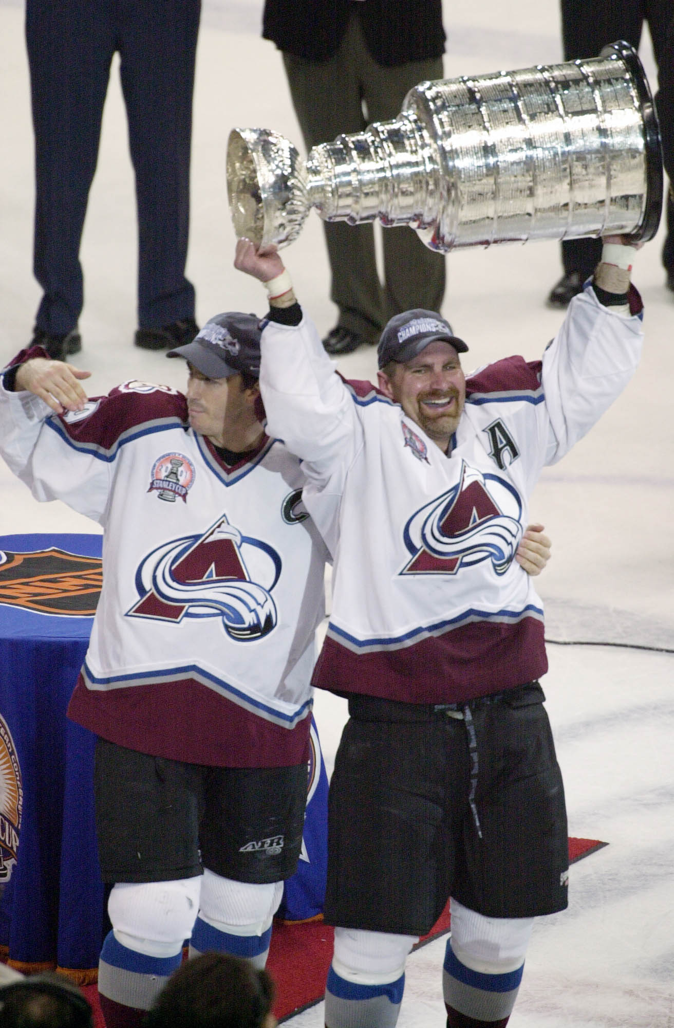 9 Jun 2001:  Joe Sakic #19 and Ray Borque #77  (right) of the Colorado Avalanche hold up the Stanley Cup after defeating the New Jersey Devils in game seven of the NHL Stanley Cup Finals at Pepsi Center in Denver, Colorado.  The Avalanche won 3-1 to take