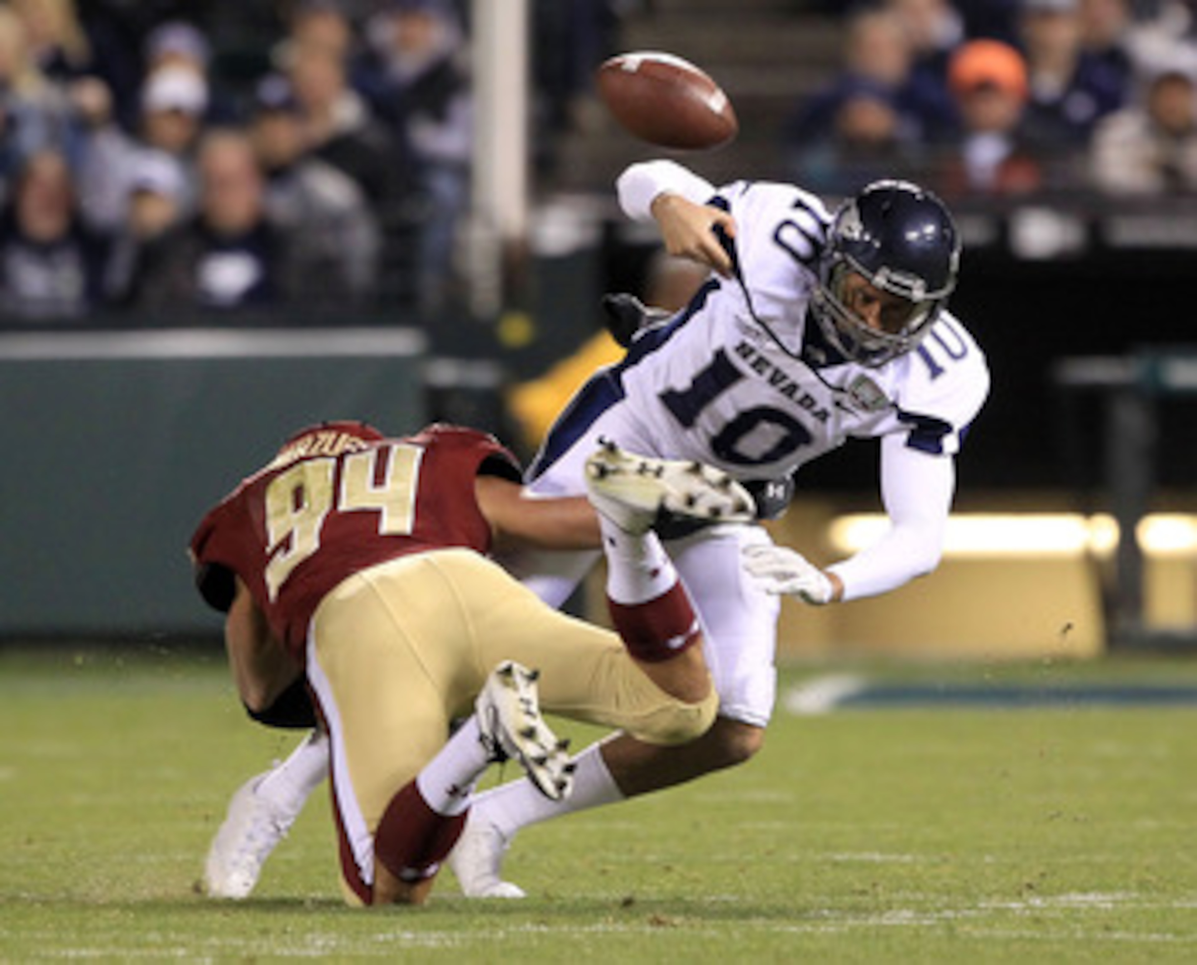 SAN FRANCISCO, CA - JANUARY 09: Colin Kaepernick #10 of the Nevada Wolf Pack fumbles the ball after being hit by Mark Herzlich #94 of the Boston College during the Kraft Fight Hunger Bowl at AT&T Park on January 9, 2011 in San Francisco, California. (Ph SAN FRANCISCO, CA - JANUARY 09: Colin Kaepernick #10 of the Nevada Wolf Pack fumbles the ball after being hit by Mark Herzlich #94 of the Boston College during the Kraft Fight Hunger Bowl at AT&T Park on January 9, 2011 in San Francisco, California. (Ph