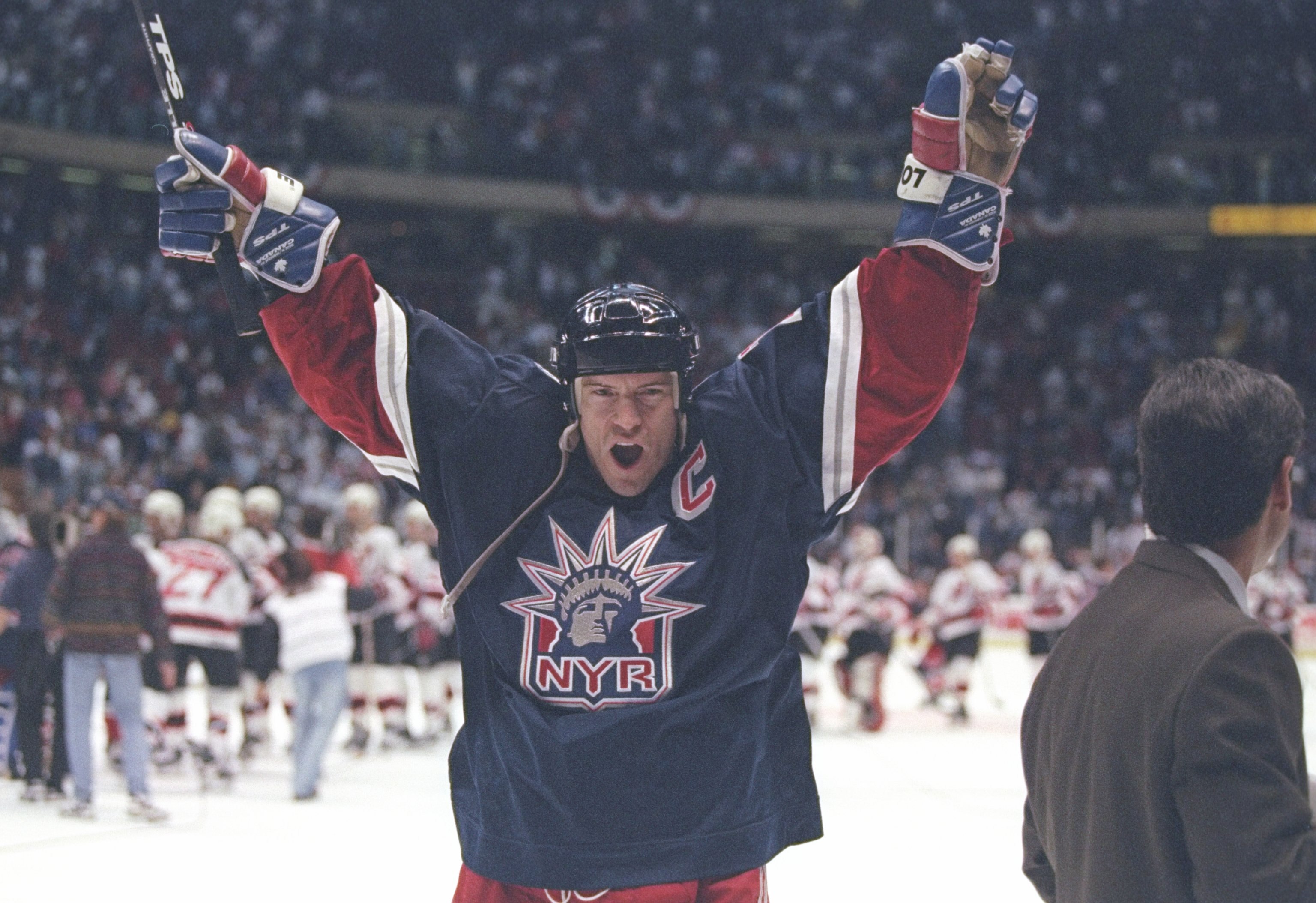 11 May 1997:  Center Mark Messier of the New York Rangers celebrates during a playoff game against the New Jersey Devils at Continental Airlines Arena in East Rutherford, New Jersey.  The Rangers won the game 2-1. Mandatory Credit: Al Bello  /Allsport