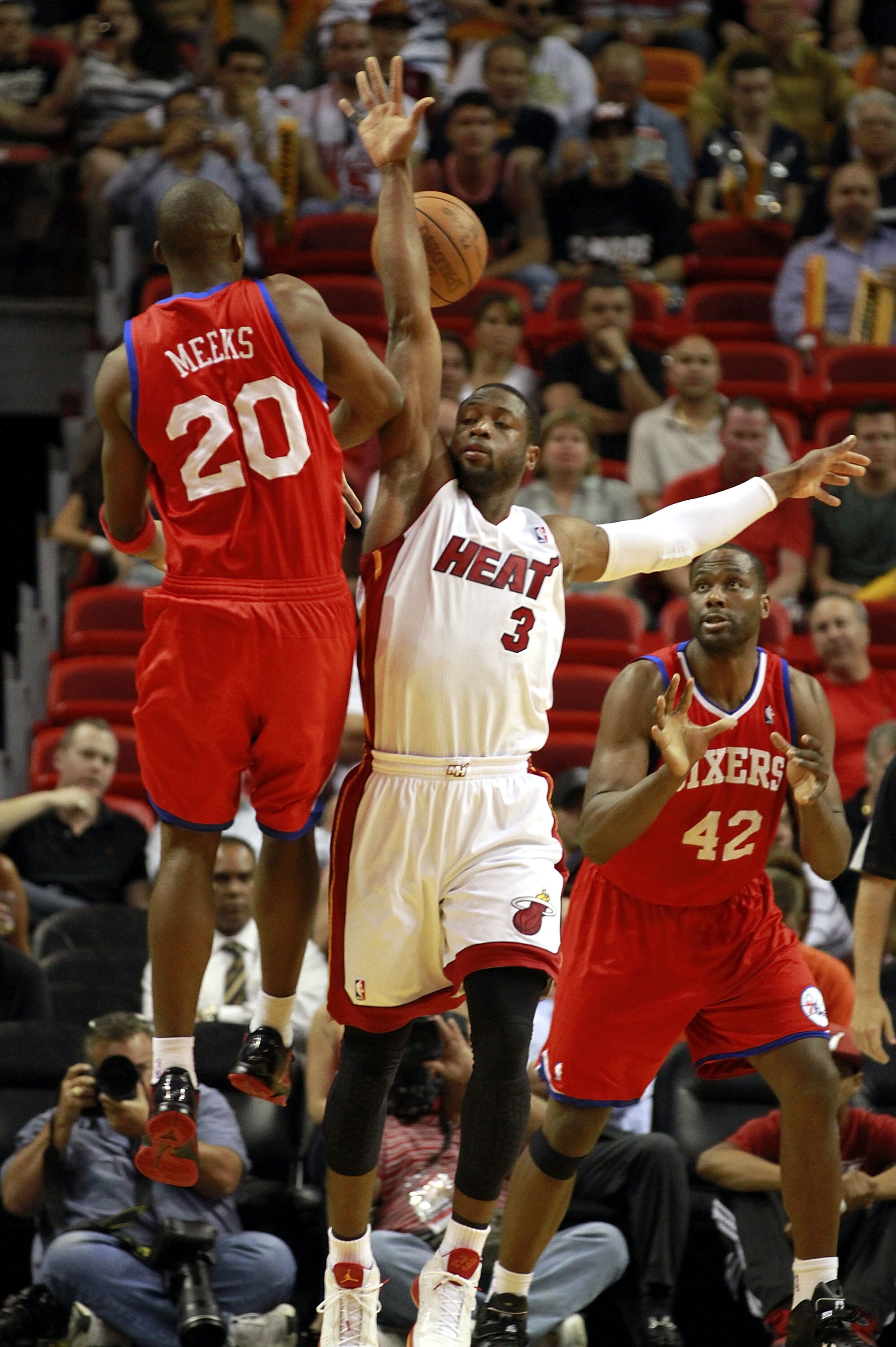 MIAMI, FL - MARCH 25:  Guard Dwyane Wade #3 of the Miami Heat defends Guard Jodie Meeks #20 of the Philadelphia Sixers at American Airlines Arena on March 25, 2011 in Miami, Florida. NOTE TO USER: User expressly acknowledges and agrees that, by downloadin