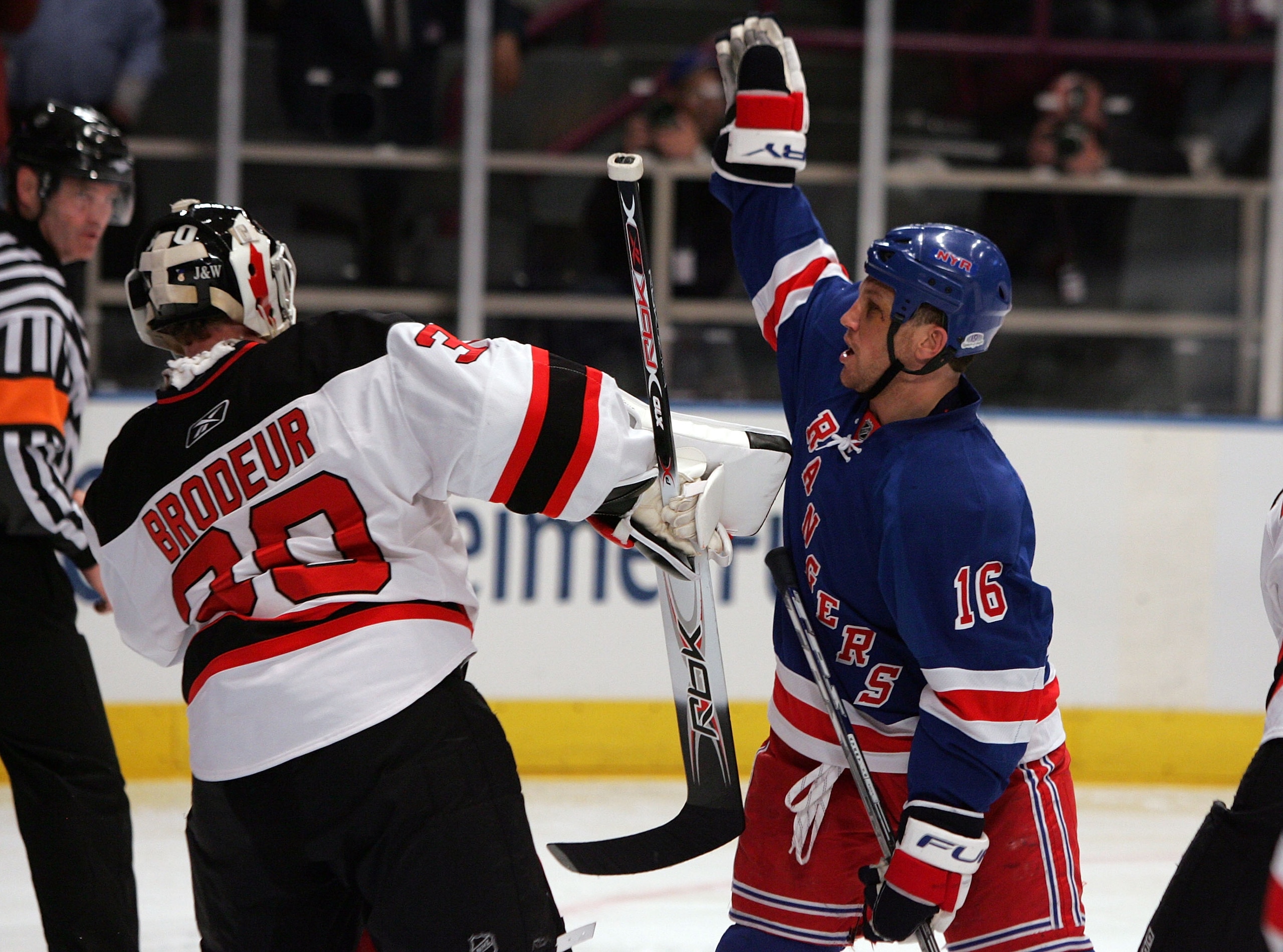 NEW YORK - APRIL 13: Sean Avery #16 of the New York Rangers tries to screen Martin Brodeur #30 of the New Jersey Devils during game three of the 2008 NHL Eastern Conference Quarterfinals on April 13, 2008 at Madison Square Garden in New York City.  (Photo
