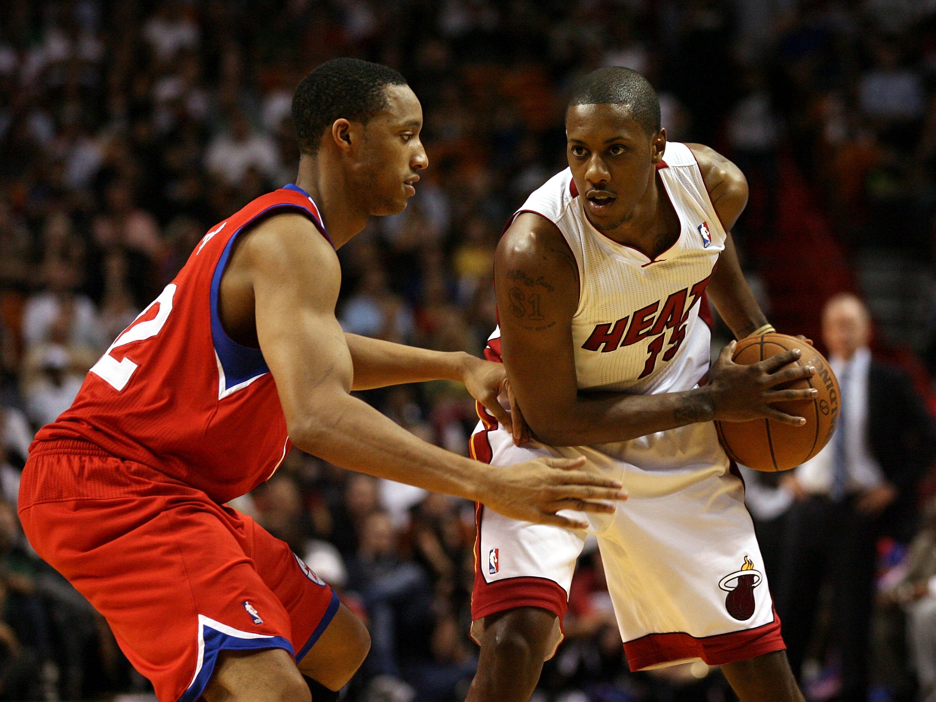 MIAMI - NOVEMBER 26:  Guard Mario Chambers #15  of the Miami Heat drives against Evan Turner #12  the Philadelphia 76ers at American Airlines Arena on November 26, 2010 in Miami, Florida. The Heat defeated the 76ers 99-90.  (Photo by Marc Serota/Getty Ima
